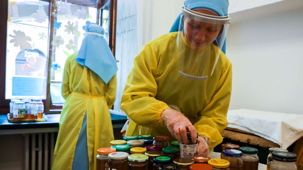Sisters Canonesses of the Holy Spirit distribute food to the poor and homeless during the COVID-19 pandemic in Krakow, Poland, on April 10, 2020.