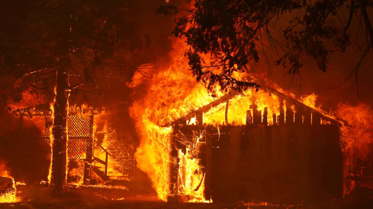 A house is fully engulfed by flames at the Dixie Fire, a wildfire near the town of Greenville, Calif., Aug. 5, 2021. With climate change triggering droughts and farmers clearing forests, the number of extreme wildfires is expected to increase 30% within the next 28 years.