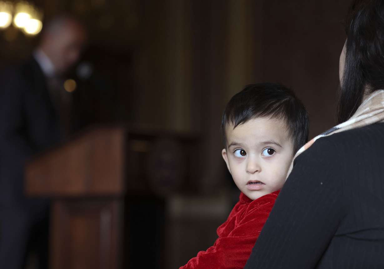 Madina Emami, 2, watches people in attendance at the kickoff for Afghan Day on the Hill at the Capitol in Salt Lake City on Wednesday.