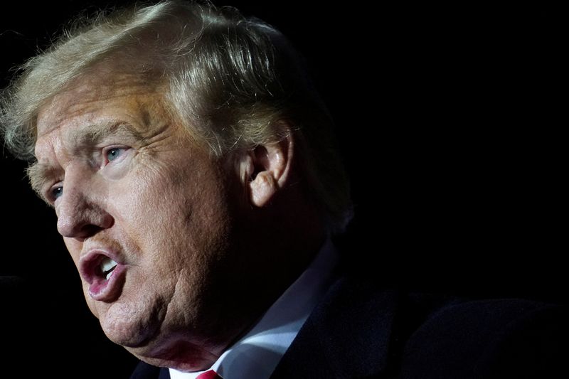 Former U.S. President Donald Trump speaks during a rally, in Conroe, Texas, Jan. 29. Two prosecutors who had been leading the Manhattan district attorney's criminal probe into Trump and his business practices have resigned, the district attorney's office said on Wednesday.