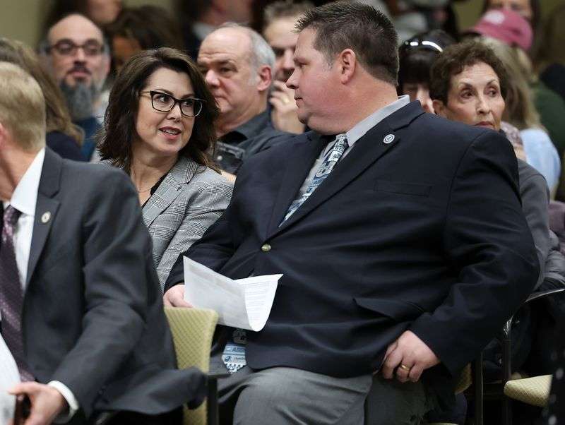 Utah Lt. Gov. Deidre Henderson talks with Utah Director
of Elections Ryan Cowley as they listen to a hearing on HB371 in
the House Government Operations Standing Committee at the Capitol
in Salt Lake City on Wednesday.