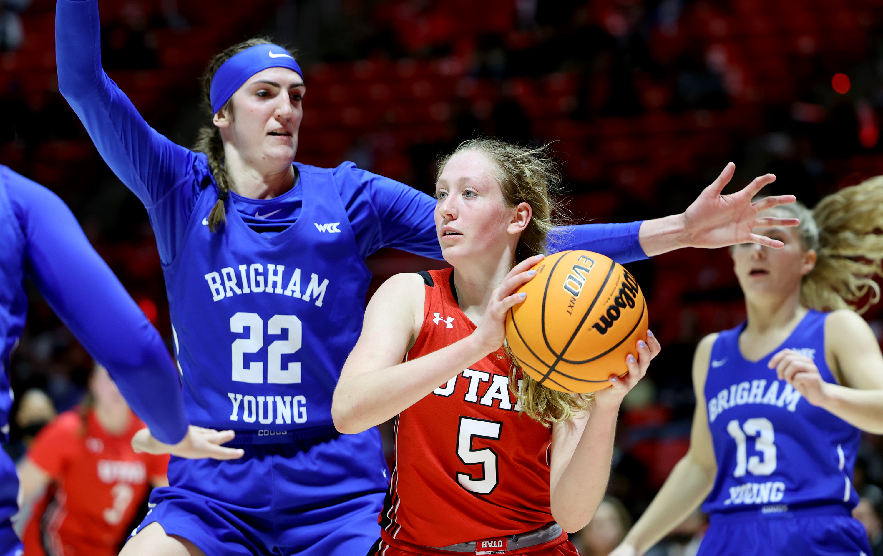 BYU Cougars center Sara Hamson (22) defends Utah Utes guard Gianna Kneepkens (5) as Utah and BYU women compete in a basketball game at the Huntsman Center in Salt Lake City on Dec. 4, 2021. BYU won 85-80.