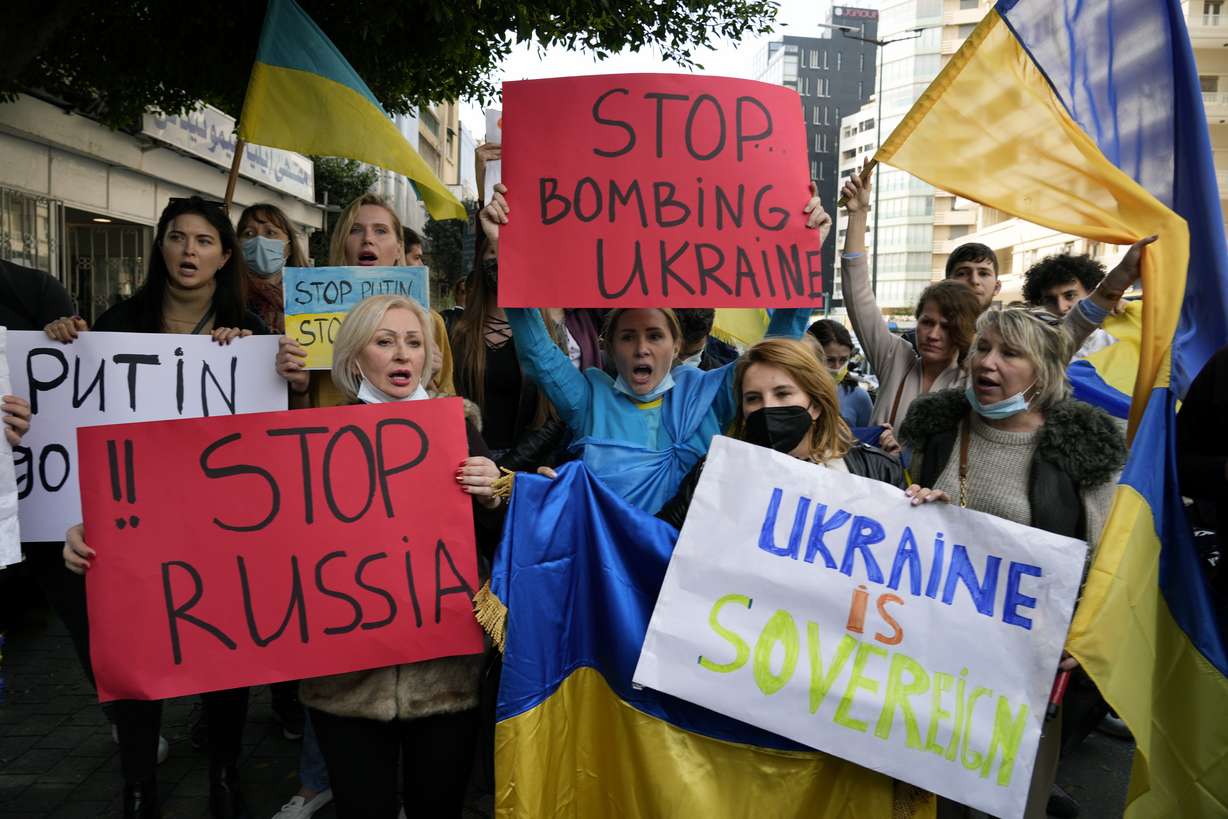 Ukrainians who live in Lebanon holds placards and chant slogans during a protest against Moscow's wide-ranging attack on their country, outside the Russian embassy in Beirut, Lebanon, Thursday.