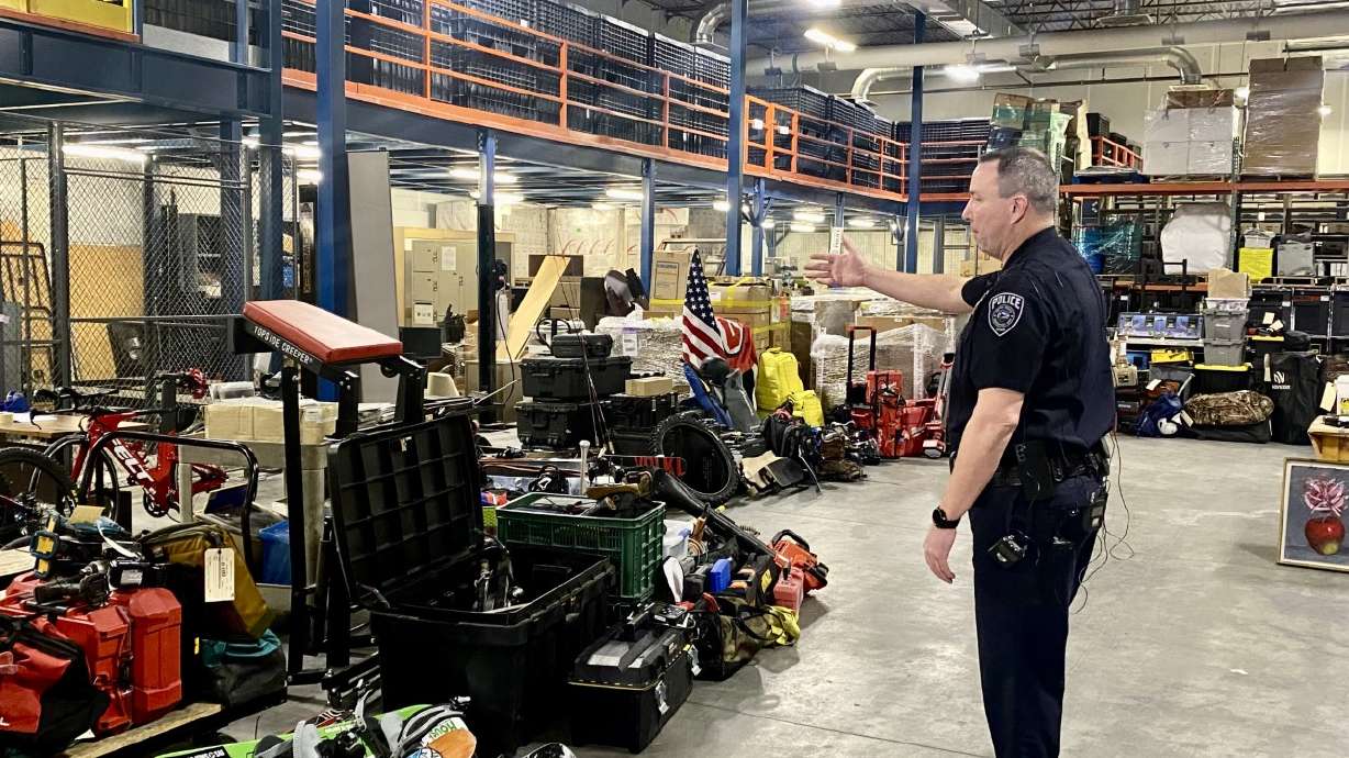 Unified Deputy Police Chief Justin Hoyal shows off hundreds of thousands of dollars of stolen property recovered by police on Feb. 8. On Wednesday night, two people were arrested who are believed to be responsible for the massive burglary ring.