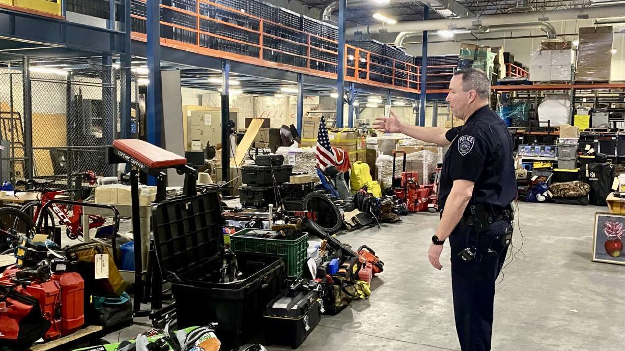 Unified Deputy Police Chief Justin Hoyal shows off hundreds of thousands of dollars of stolen property recovered by police on Feb. 8. On Wednesday night, two people were arrested who are believed to be responsible for the massive burglary ring.