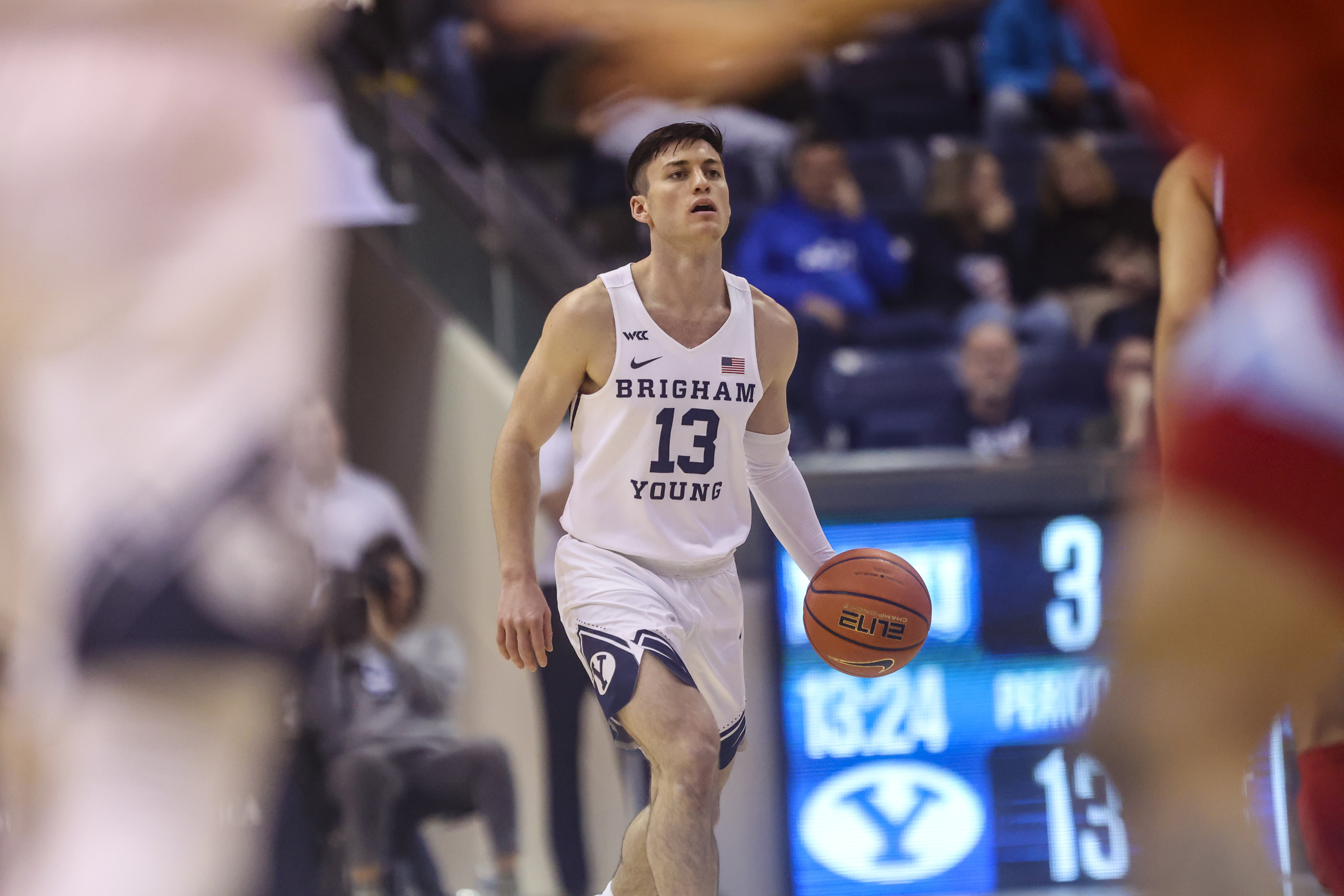 Brigham Young Cougars guard Alex Barcello (13) looks for an open teammate as Brigham Young Cougars plays Loyola Marymount Lions in an NCAA basketball game at Marriott Center in Provo on Thursday, Feb. 24, 2022.