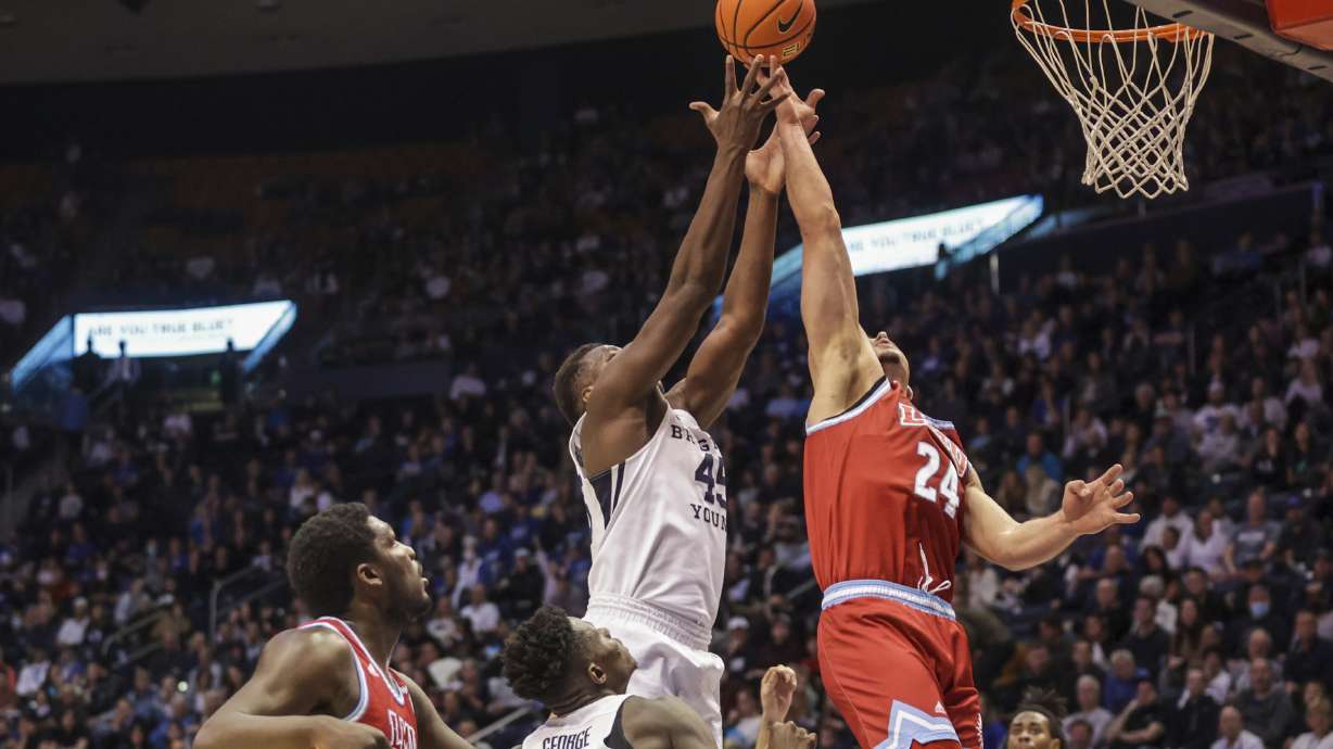 Loyola Marymount Lions forward Alex Merkviladze (24) grabs a rebound as Brigham Young Cougars plays Loyola Marymount Lions in an NCAA basketball game at Marriott Center in Provo on Thursday, Feb. 24, 2022.