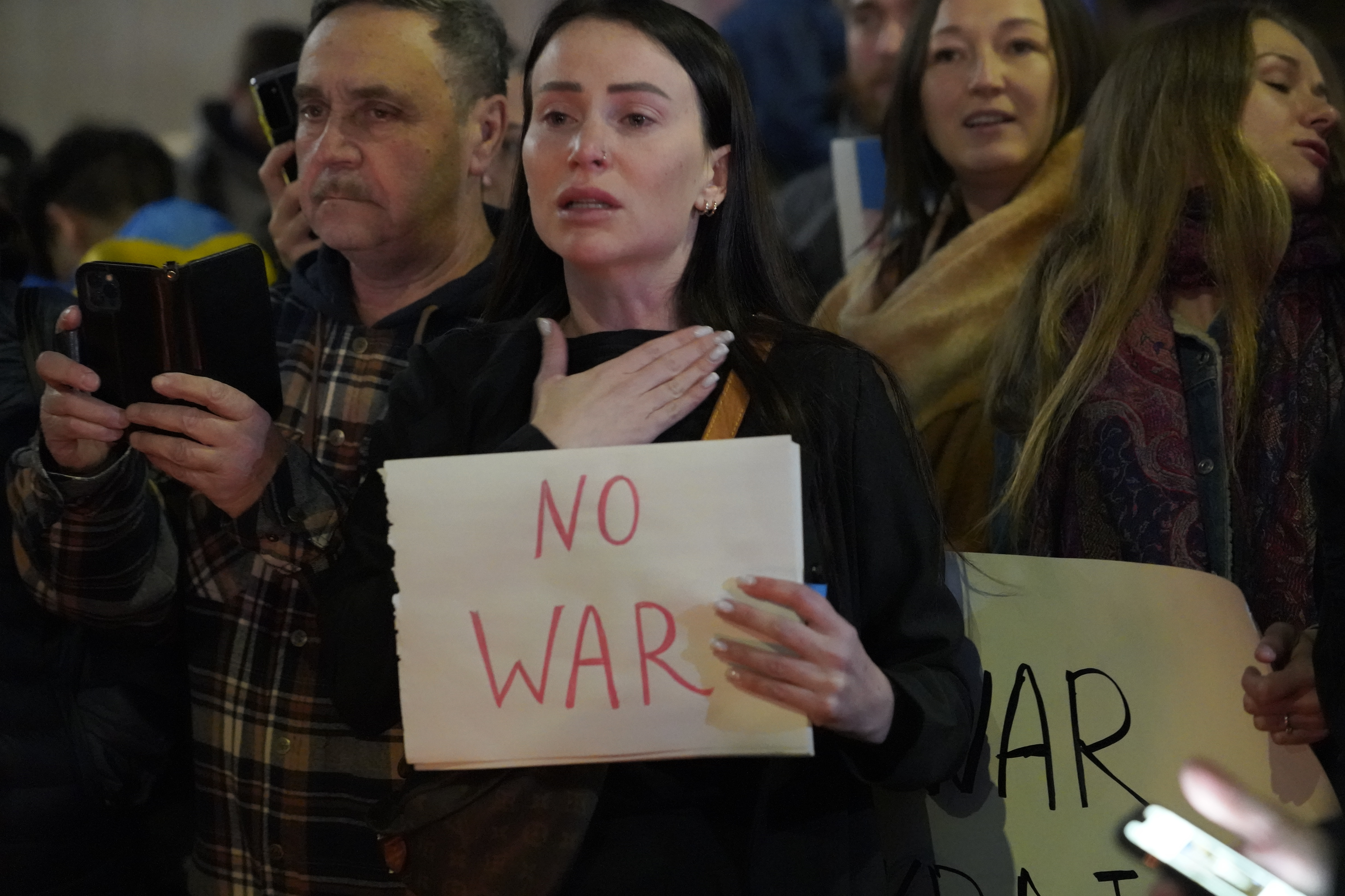 People protest the Russian invasion of Ukraine at a demonstration in the Studio City neighborhood of Los Angeles, Thursday.