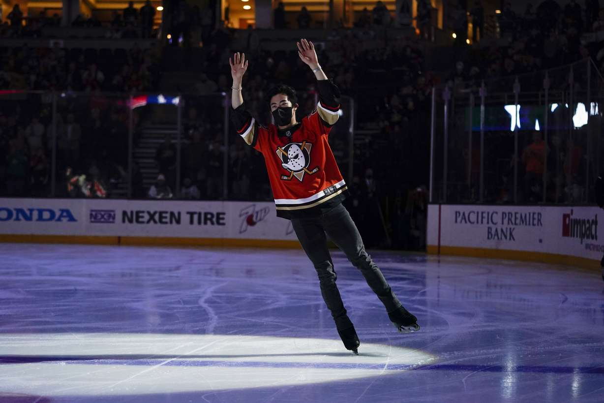 Olympic figure skating gold medalist Nathan Chen acknowledges the crowd before an NHL hockey game between the Anaheim Ducks and the Los Angeles Kings on Friday, Feb. 25, 2022, in Anaheim, Calif.