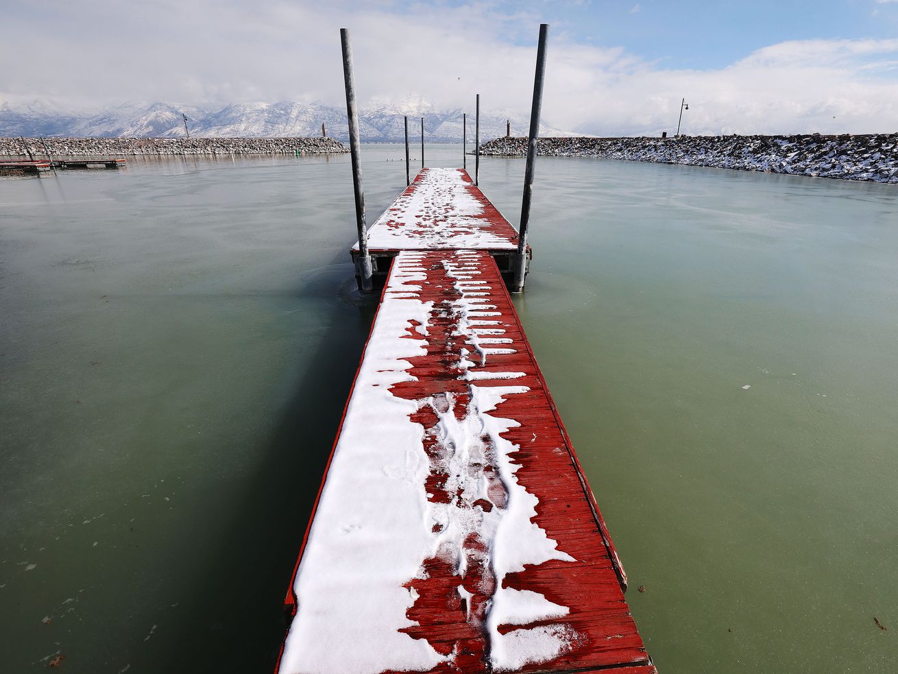 A snow-covered dock at the Saratoga Springs Marina at Utah Lake is pictured on Friday. Although it might be the year of the Great Salt Lake in the Legislature, two bills that lawmakers say will steer Utah Lake toward a cleaner future cleared a big hurdle on Friday.