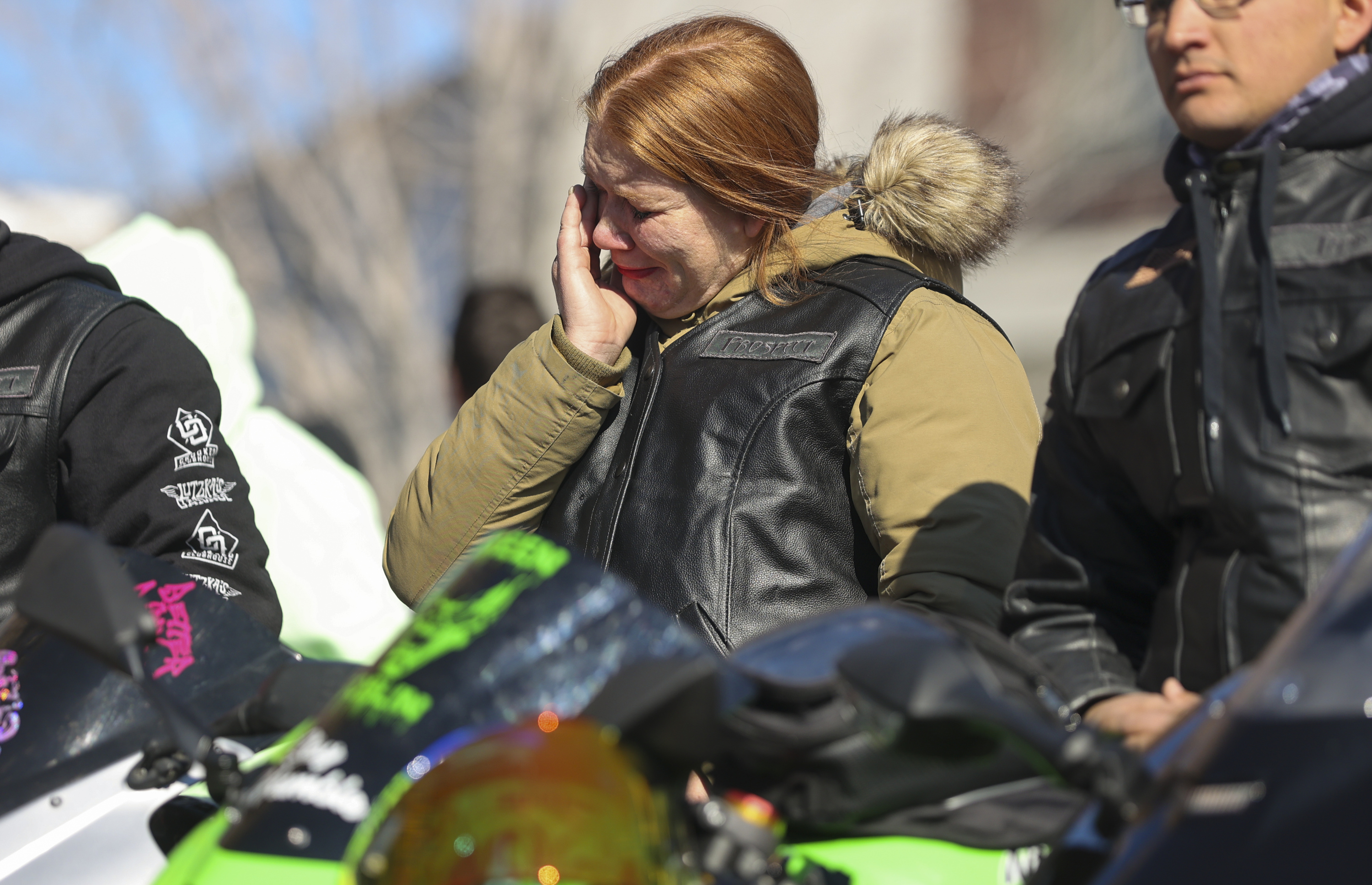 Tasha Clark cries during the vigil to in memory Greg Workman, who died in a wrong-way accident on Feb. 20, at Hatch Park in North Salt Lake on Saturday.