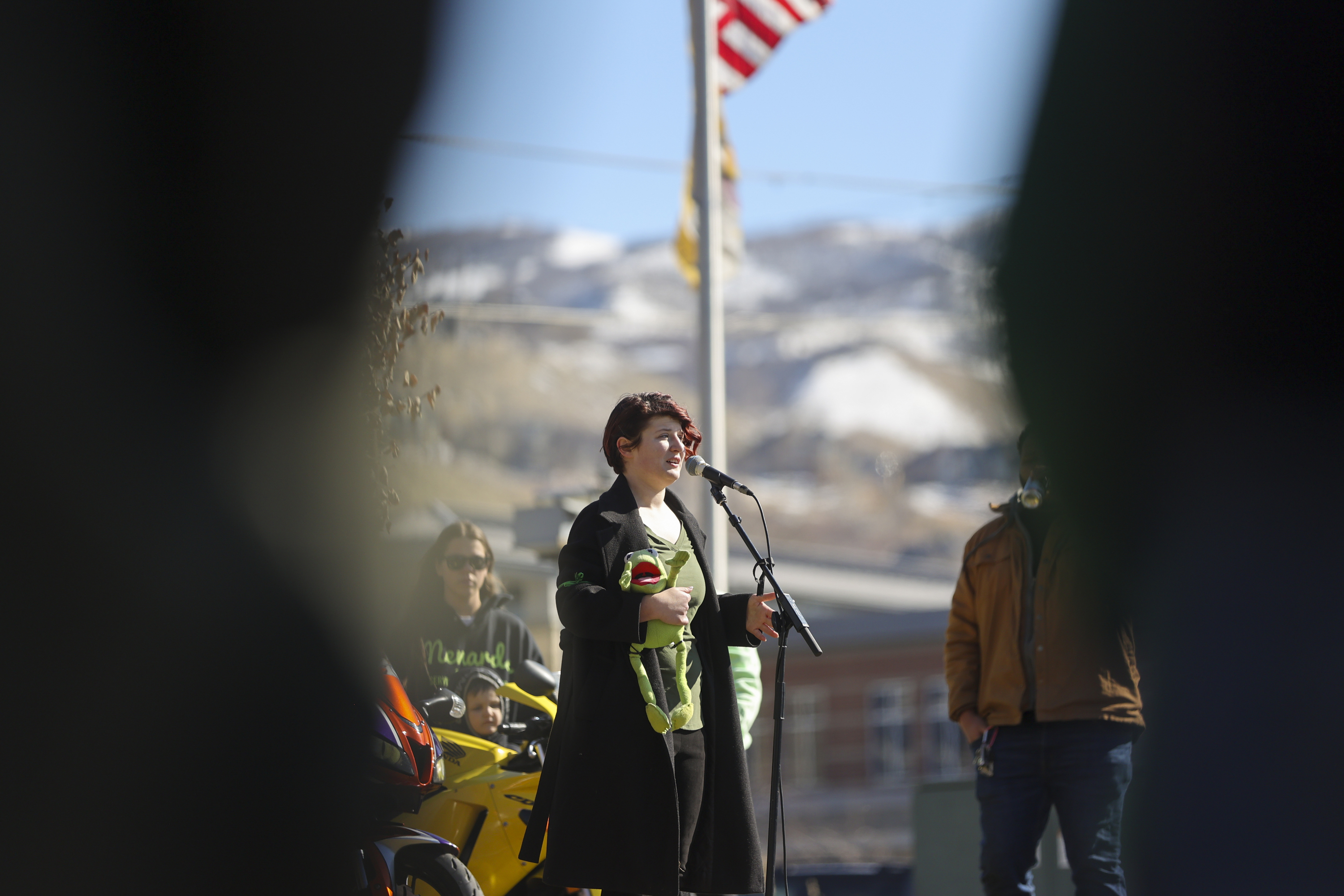 Katie Workman, the sister of Greg Workman, who died in a wrong-way accident on Feb. 20, speaks at the vigil for Greg at Hatch Park in North Salt Lake on Saturday.