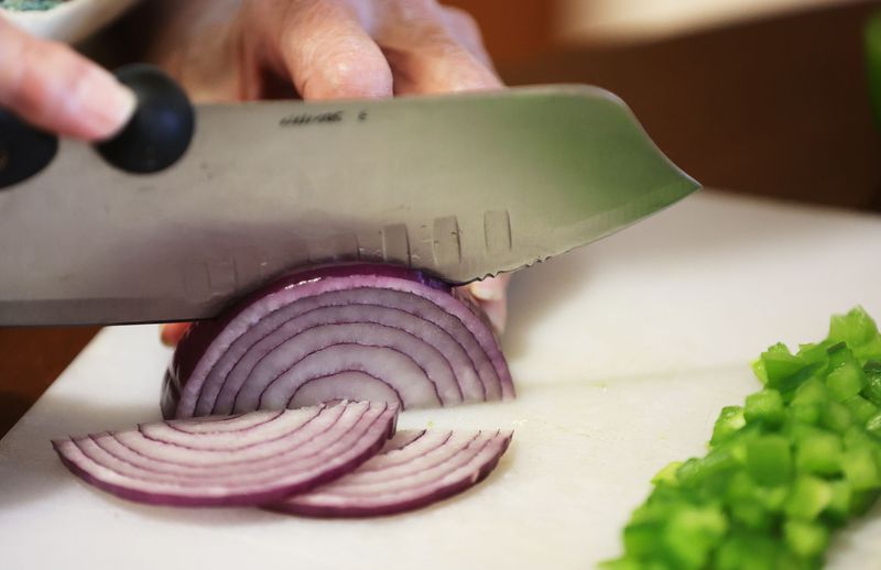 Janice Lamm prepares food for a meal at her home in
West Jordan on Wednesday, Feb. 9, 2022. Lamm used Chefpanzee food
delivery service during early COVID-19. West Jordan used federal
pandemic relief money to create the program, which is open to
anyone over the age of 65 residing within the city boundaries, with
preference going to those in low- to moderate-income
categories.