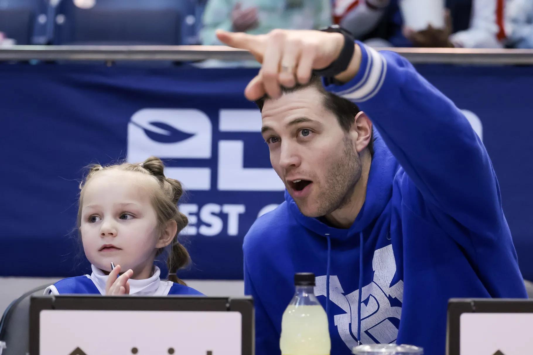 Jimmer Fredette and his 5-year-old daughter Wesley watch the Brigham Young Cougars play the Pepperdine Waves at the Marriott Center in Provo on Saturday.