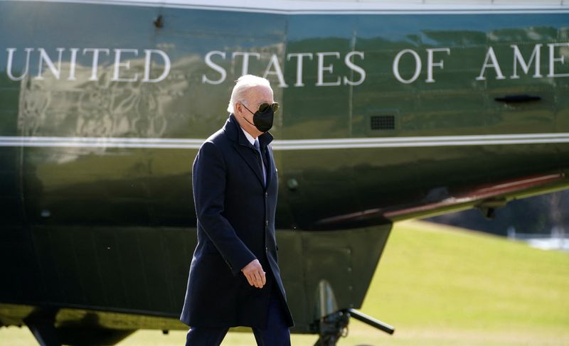 President Joe Biden walks from Marine One upon his return to the White House in Washington, Monday. Biden will shift emphasis away from his Build Back Better spending plan when he delivers his State of the Union address on Tuesday, focusing instead on a four-point plan to save the U.S. economy