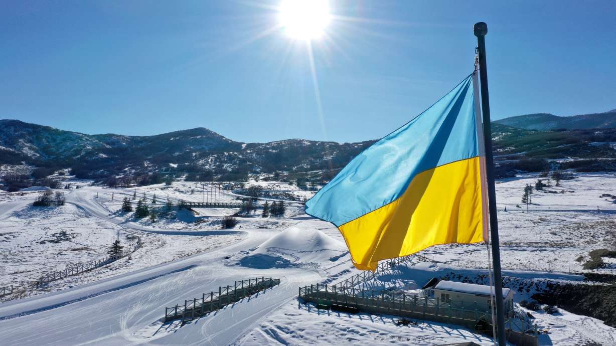 A Ukrainian flag waves in the wind over the Soldier Hollow Nordic Center for the 2022 Biathlon Youth and Junior World Championships in Midway on Monday.