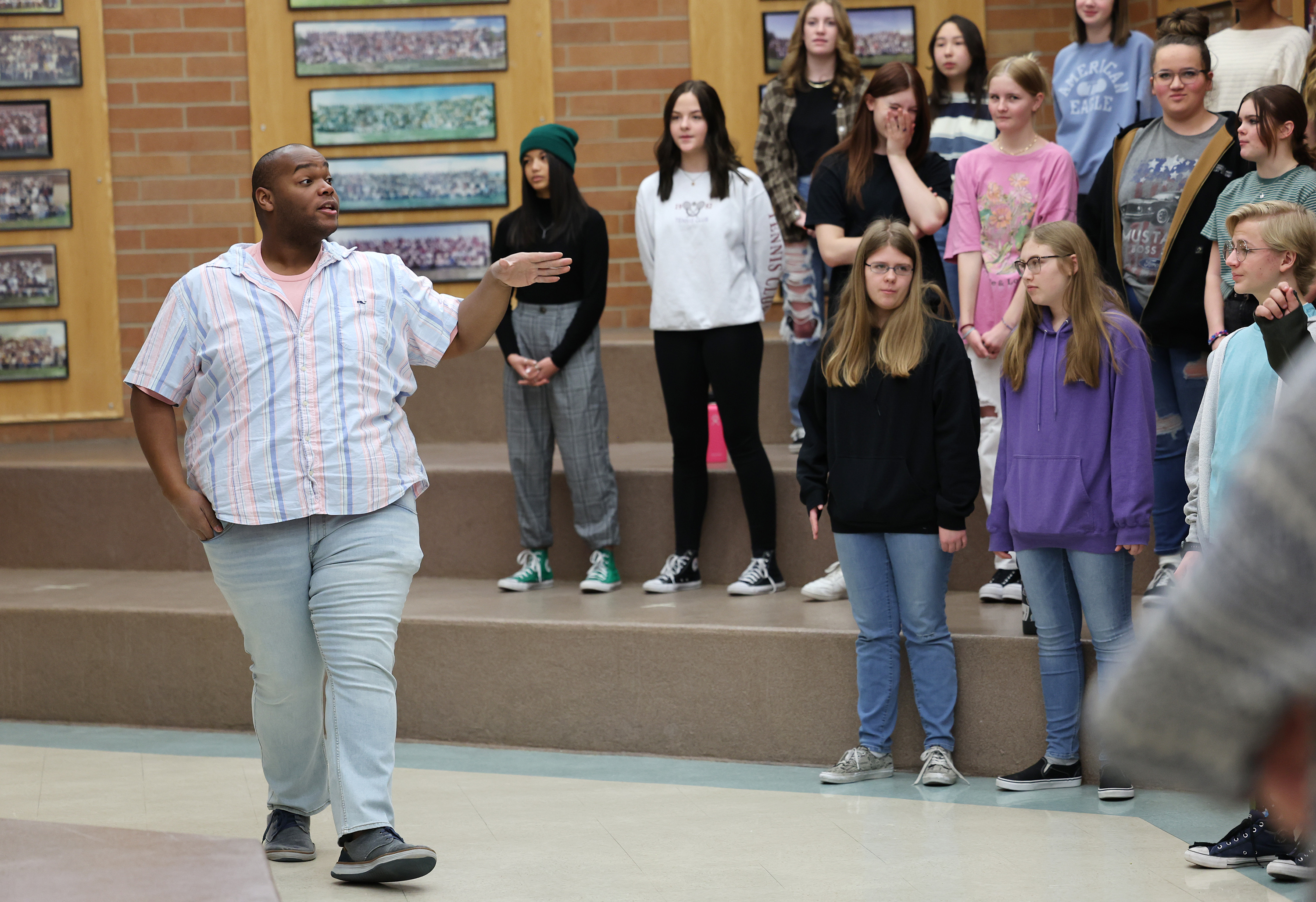 Mountain Ridge Junior High choir teacher Alec Powell works with students in the concert singers class at the school in Highland on Monday.