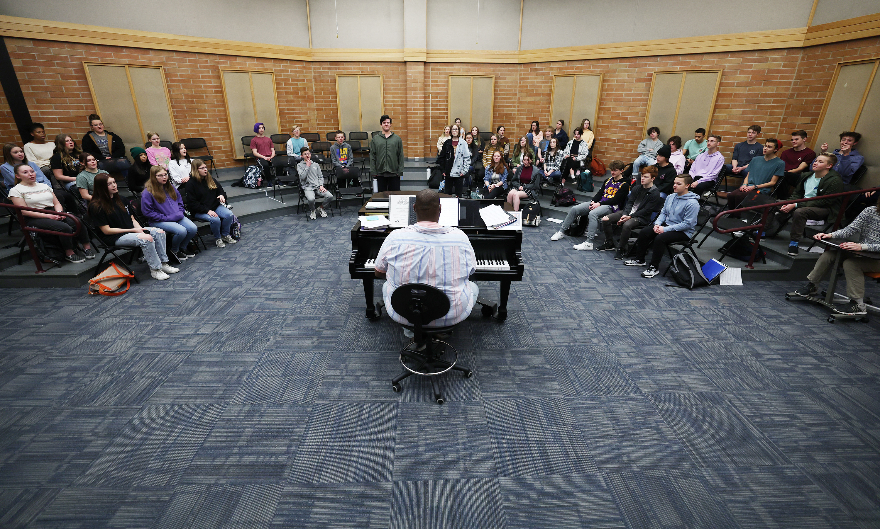 Mountain Ridge Junior High choir teacher Alec Powell works with students in the concert singers class at the school in Highland on Monday. Powell in February was named to Yamaha's 40 Under 40, a list recognizing outstanding music educators under 40 years old who are making a difference by growing and strengthening their music programs.