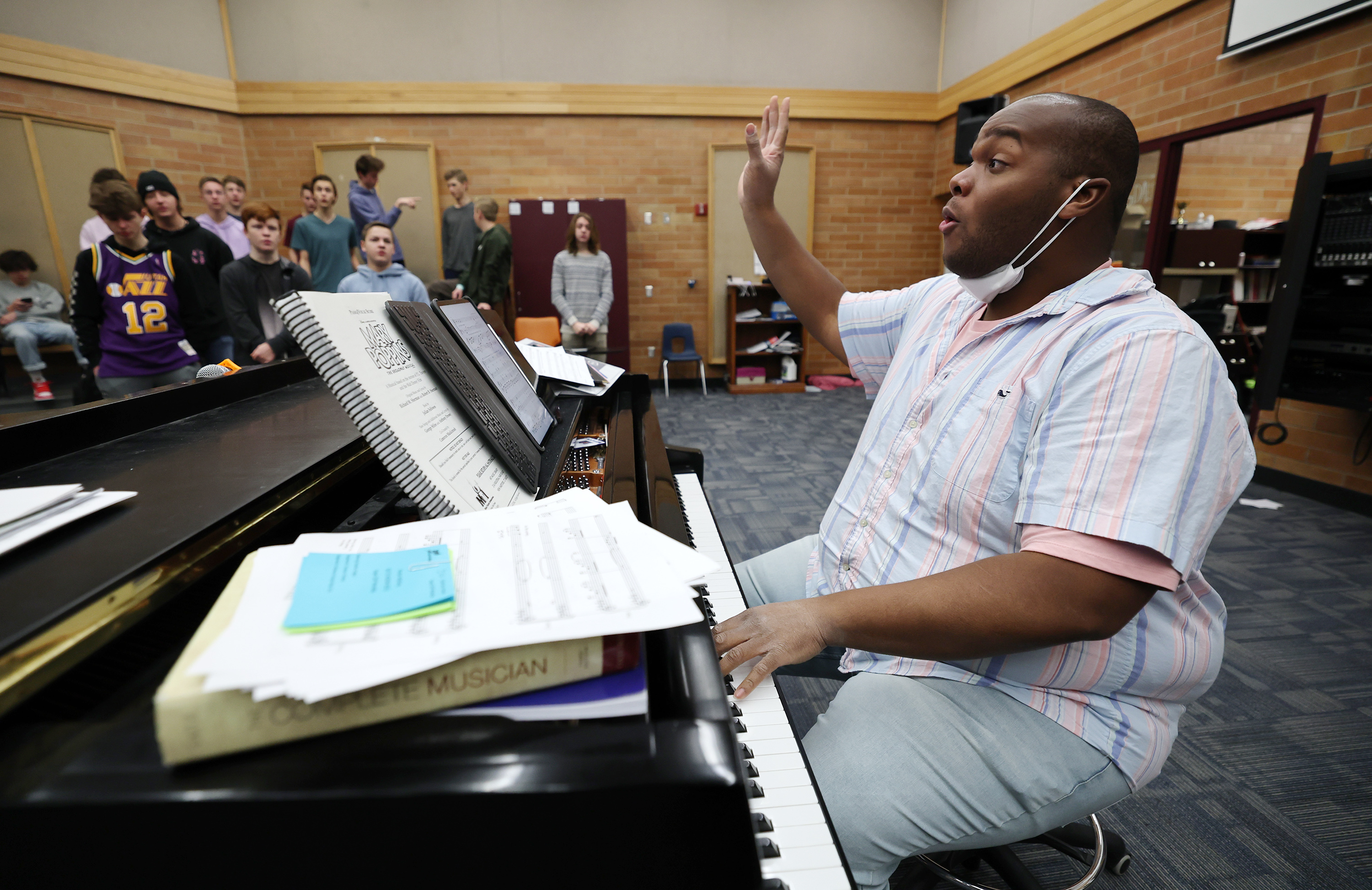 Mountain Ridge Junior High choir teacher Alec Powell works with students in the concert singers class at the school in Highland on Monday. Powell in February was named to Yamaha's 40 Under 40, a list recognizing outstanding music educators under 40 years old who are making a difference by growing and strengthening their music programs.