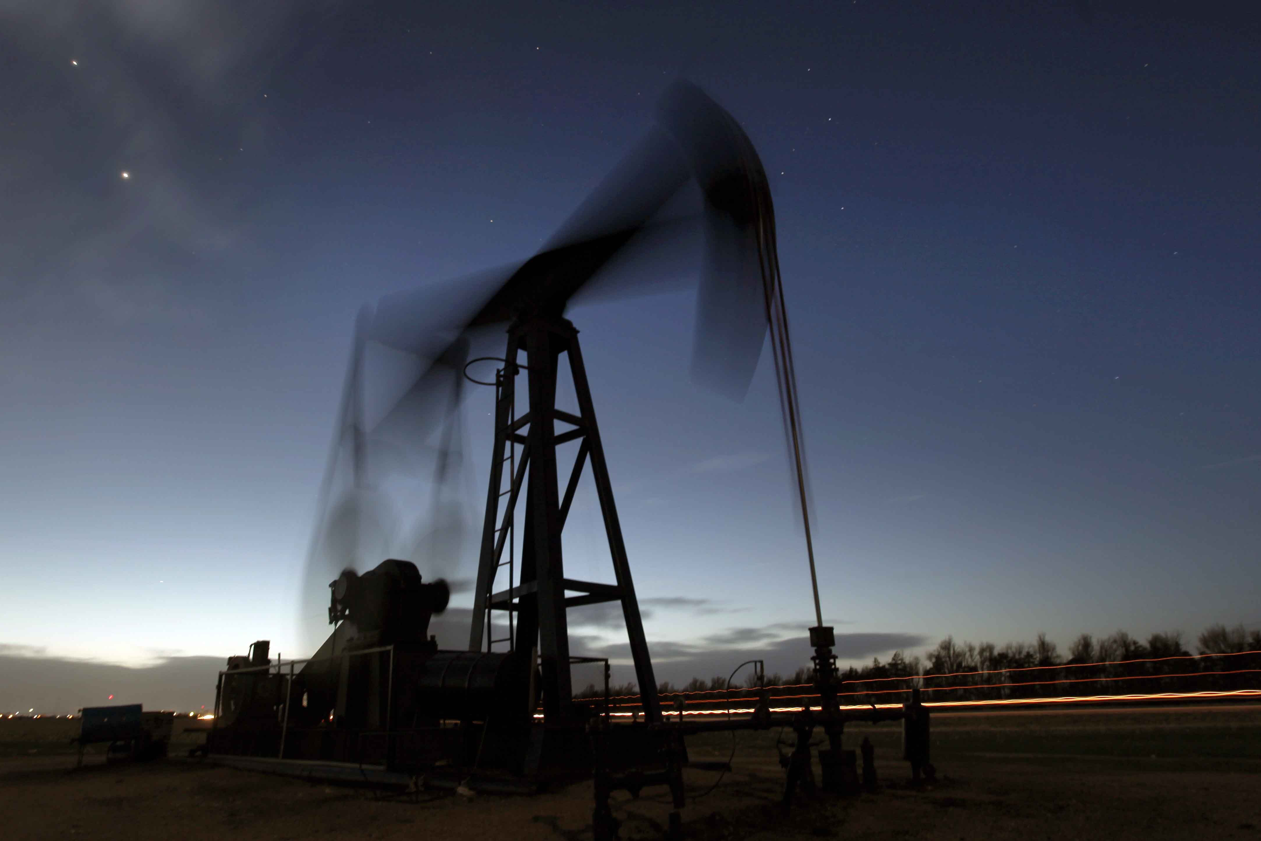 An oil pumping unit near Greensburg, Kan., on March 6, 2012. The International Energy Agency says all 31 member countries have agreed to release 60 million barrels of oil from their strategic reserves Tuesday.