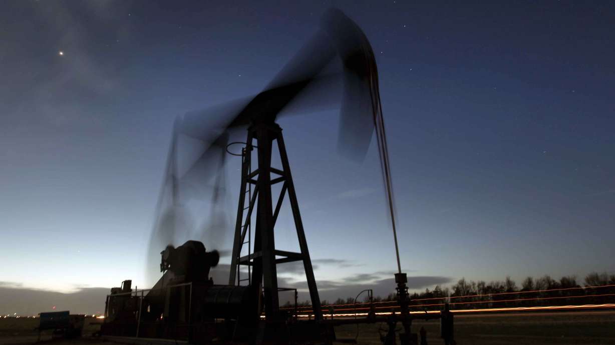 An oil pumping unit near Greensburg, Kan., on March 6, 2012. The International Energy Agency says all 31 member countries have agreed to release 60 million barrels of oil from their strategic reserves Tuesday.
