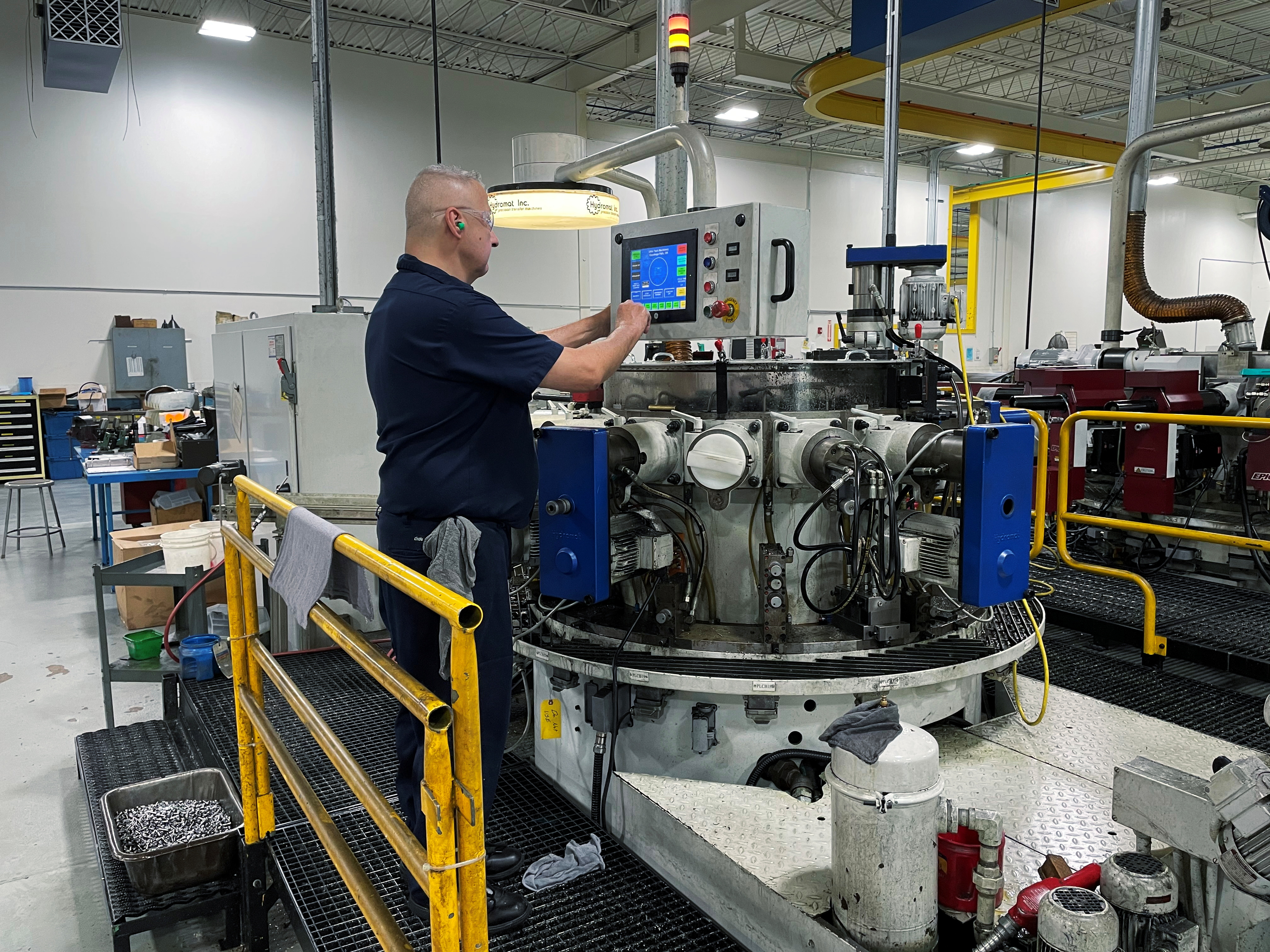 A worker operates one of the metal cutting machines at Gent Machine Co.'s factory in Cleveland, Ohio, May 26, 2021. U.S. manufacturing activity picked up more than expected in February as COVID-19 infections subsided, though hiring at factories slowed, contributing to keeping supply chains snarled and prices for inputs high.