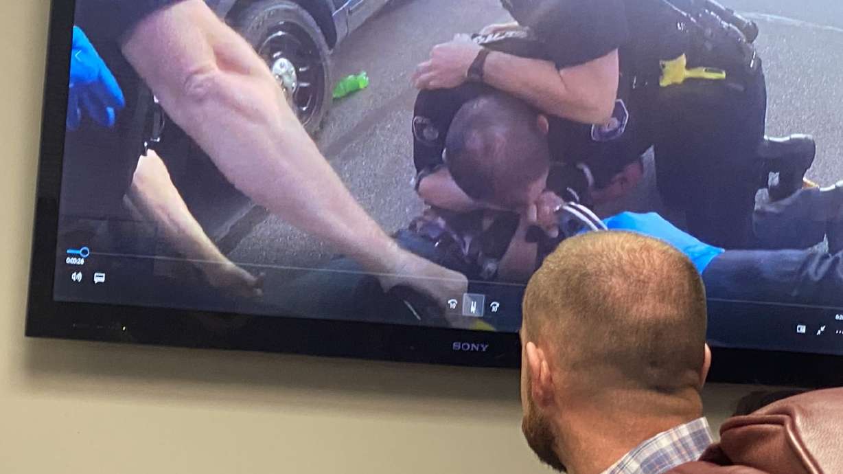 Cody Greenland watches body camera video of his arrest in 2020 from his attorney's office in Salt Lake City on Tuesday. Greenland is now suing the American Fork Police Department.