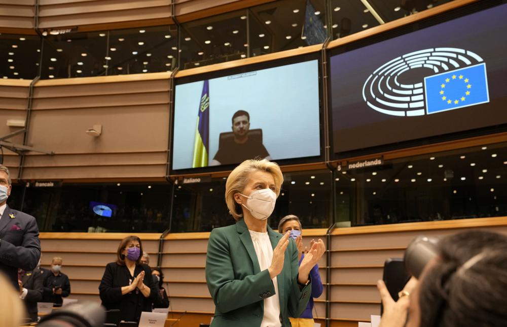 European Commission President Ursula von der Leyen applauds after an address by Ukraine's President Volodymyr Zelenskyy, via video link, during an extraordinary session on Ukraine at the European Parliament in Brussels, Tuesday.