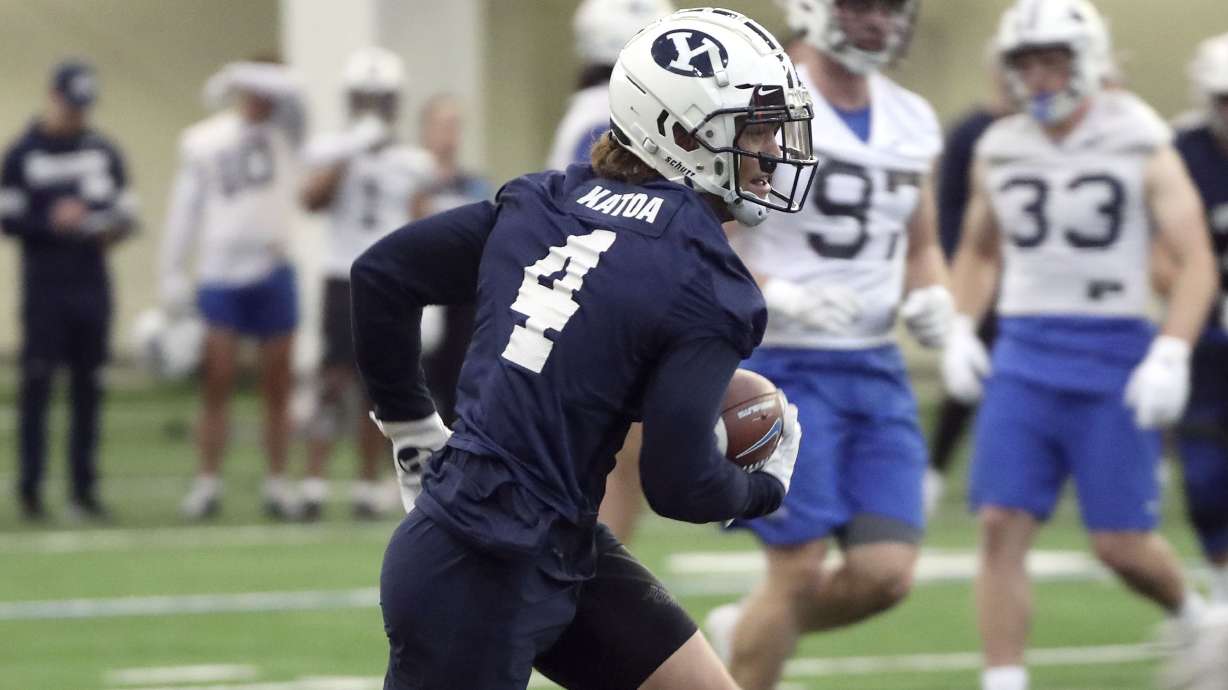 BYU running back Lopini Katoa runs with the ball during practice in the Indoor Practice Facility at BYU in Provo on Monday, Feb. 28, 2022.