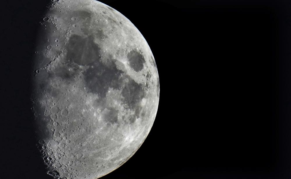 Impact craters cover the surface of the moon, seen from Berlin, Germany, Jan. 11.  A leftover rocket is expected to smash into the far side of the moon at 5,800 mph (9,300 kph) on Friday, away from telescopes’ prying eyes. It may take weeks, even months, to confirm the impact through satellite images.