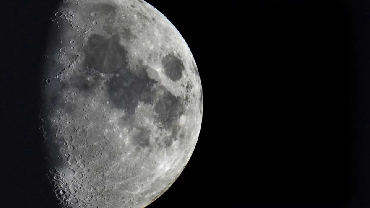 Impact craters cover the surface of the moon, seen from Berlin, Germany, Jan. 11. A leftover rocket is expected to smash into the far side of the moon at 5,800 mph (9,300 kph) on Friday, away from telescopes’ prying eyes. It may take weeks, even months, to confirm the impact through satellite images.