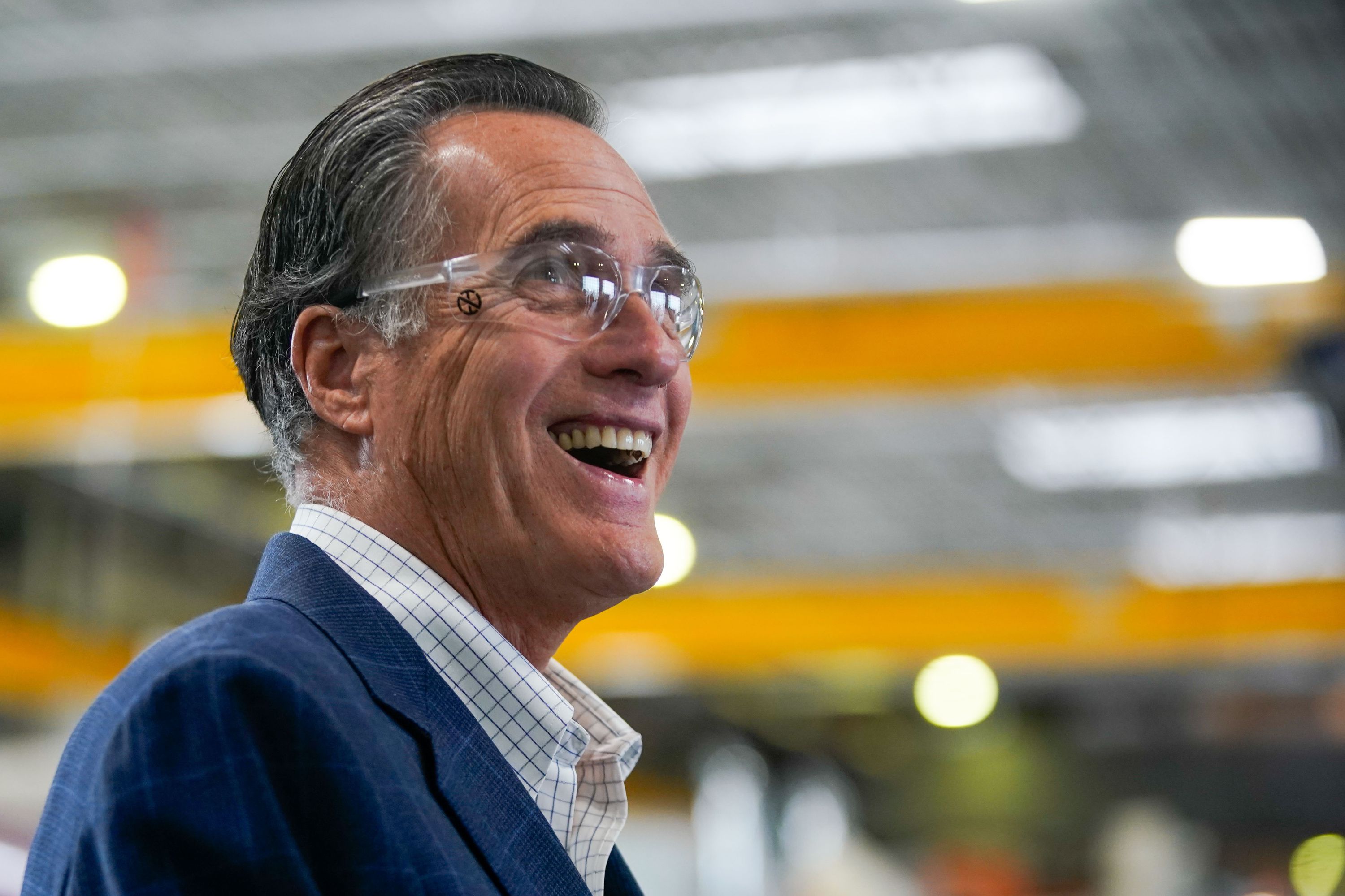 Sen. Mitt Romney, R-Utah, laughs as he tours Kenworth Sales in West Valley City on Nov. 12, 2021. Before the federal government spends another dollar on COVID-19 relief, Romney and many of his Republican colleagues want to know what happened to the trillions already out there.