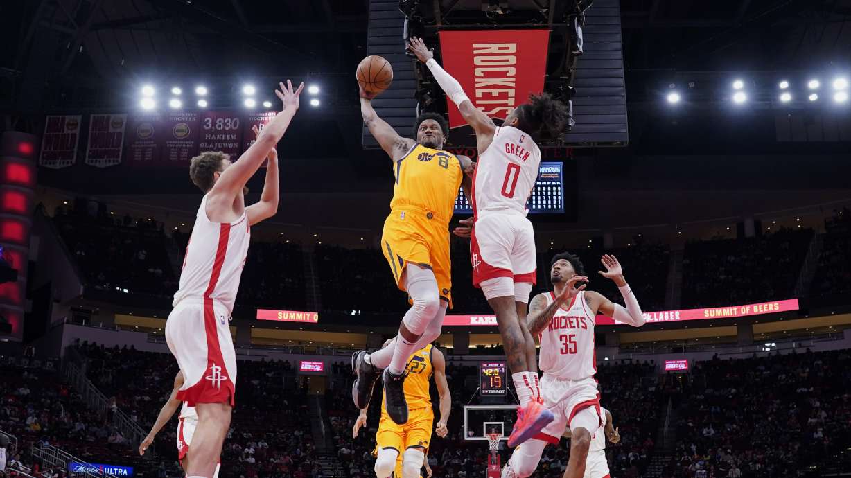 Utah Jazz's Rudy Gay (8) goes up for a shot as Houston Rockets' Jalen Green (0) defends during the first half of an NBA basketball game Wednesday, March 2, 2022, in Houston.