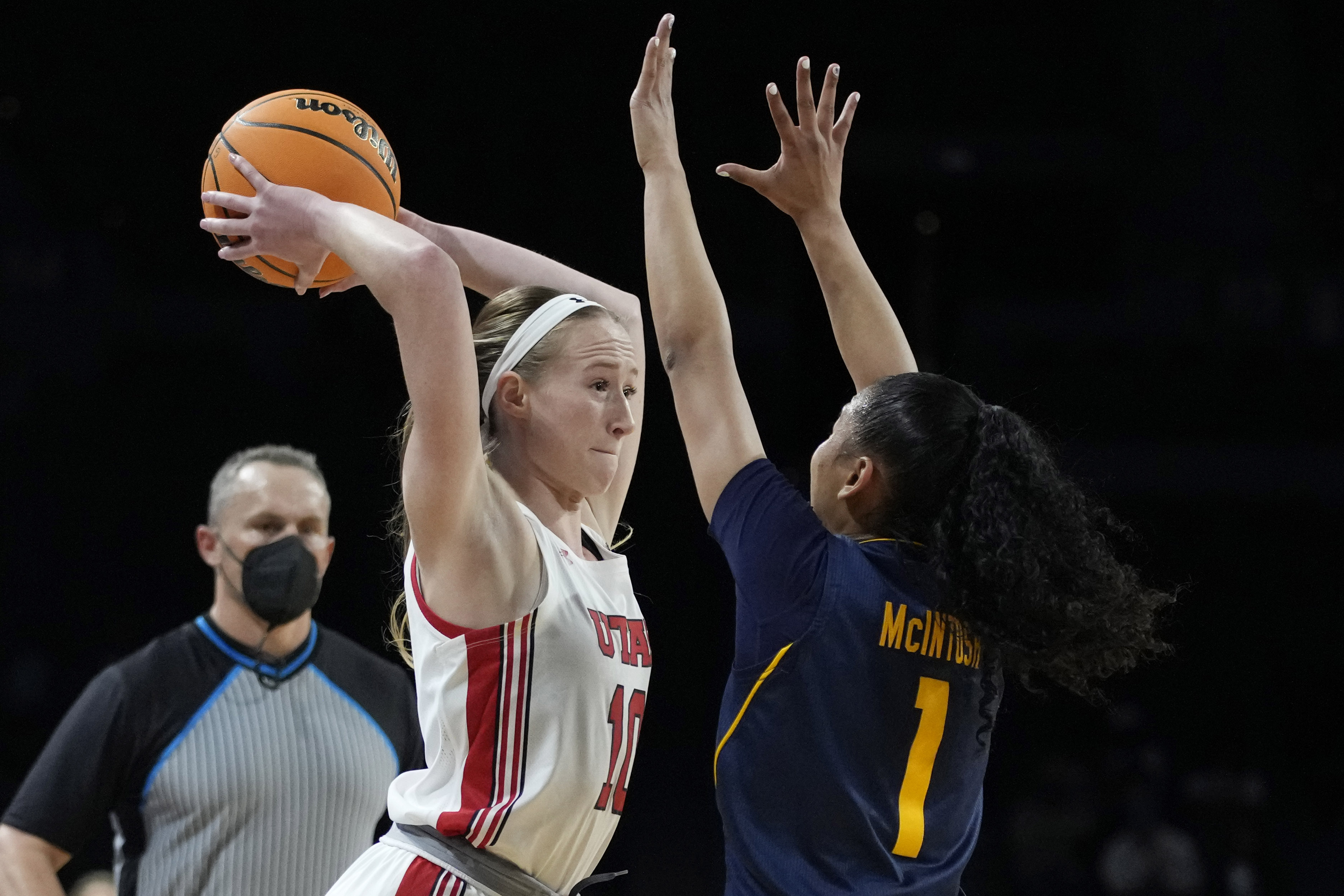 Utah's Dru Gylten (10) passes around California's Leilani McIntosh (1) during the first half of an NCAA college basketball game in the first round of the Pac-12 women's tournament Wednesday, March 2, 2022, in Las Vegas.