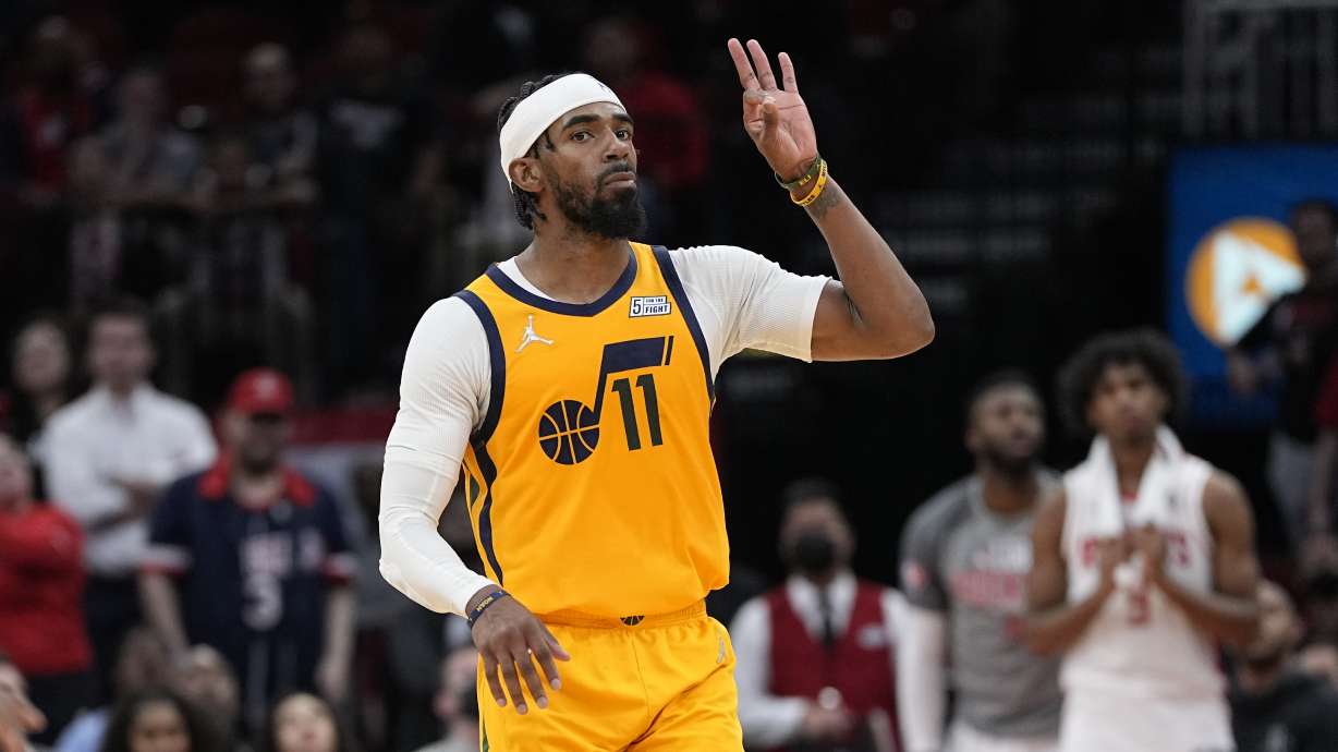 Utah Jazz's Mike Conley (11) celebrates after making a 3-point basket during overtime of an NBA basketball game against the Houston Rockets Wednesday, March 2, 2022, in Houston. The Jazz won 132-127 in overtime.