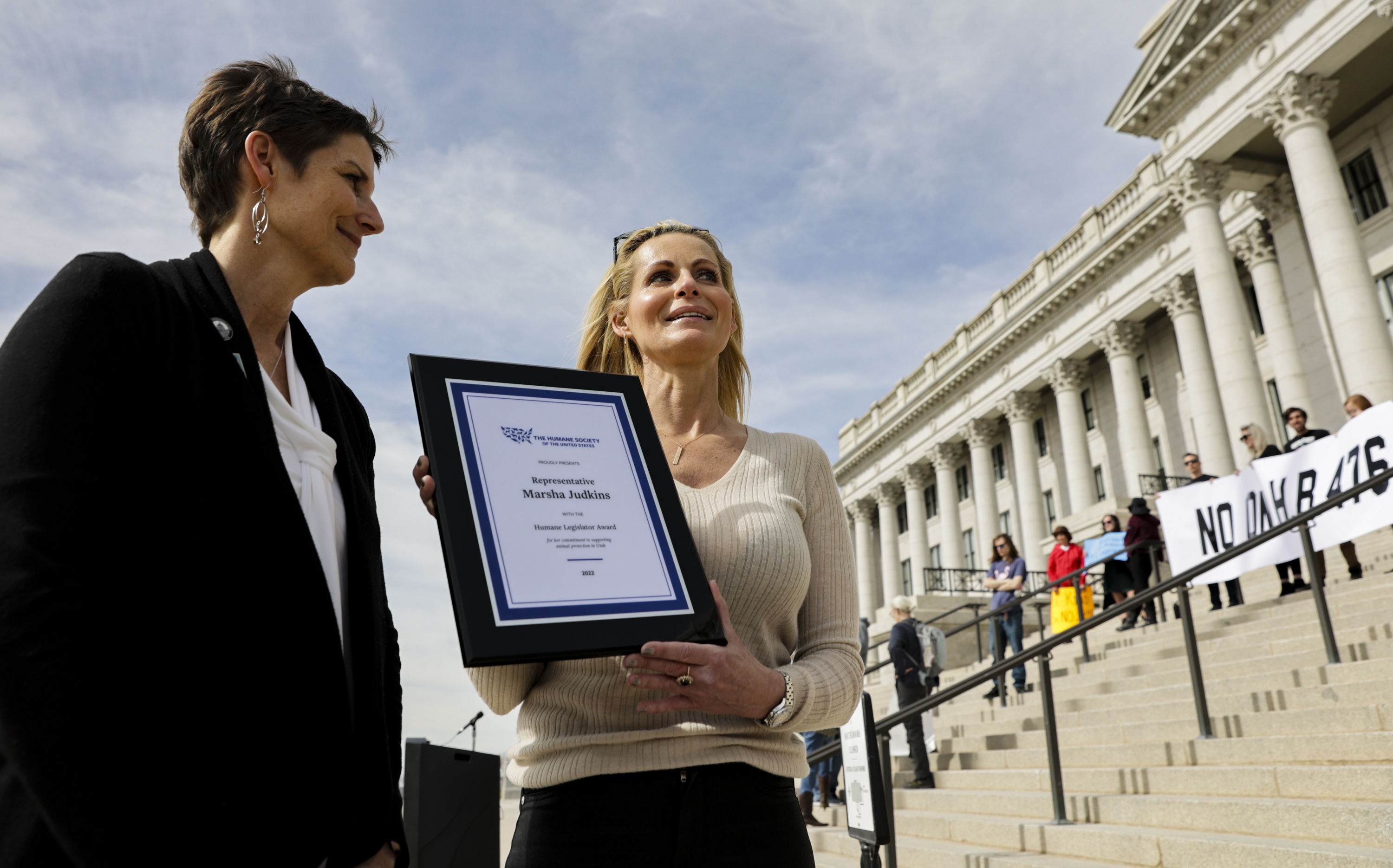 Rep. Marsha Judkins, R-Provo, left, is presented with a Humane Legislator Award by Sundays Hunt, Utah director of the Humane Society, during a rally in opposition to HB476 at the Capitol in Salt Lake City on Thursday. The bill would halt local governments in Utah from regulating any animal- or animal product-related businesses, including puppy mills and pet stores.