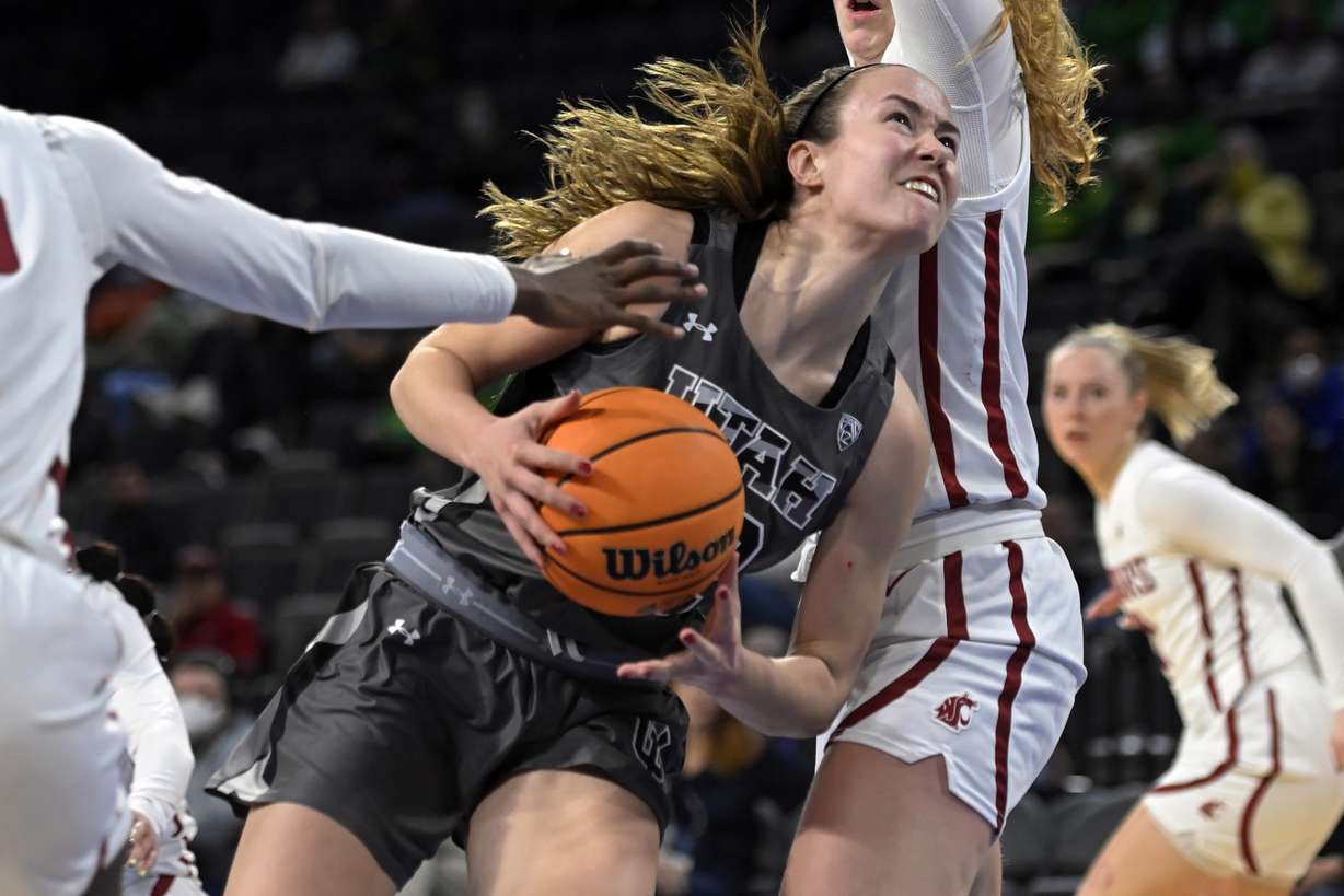 Utah forward Jenna Johnson (22) drives to the basket against Washington State during the second half of an NCAA college basketball game in the quarterfinals of the Pac-12 women's tournament Thursday, March 3, 2022, in Las Vegas.