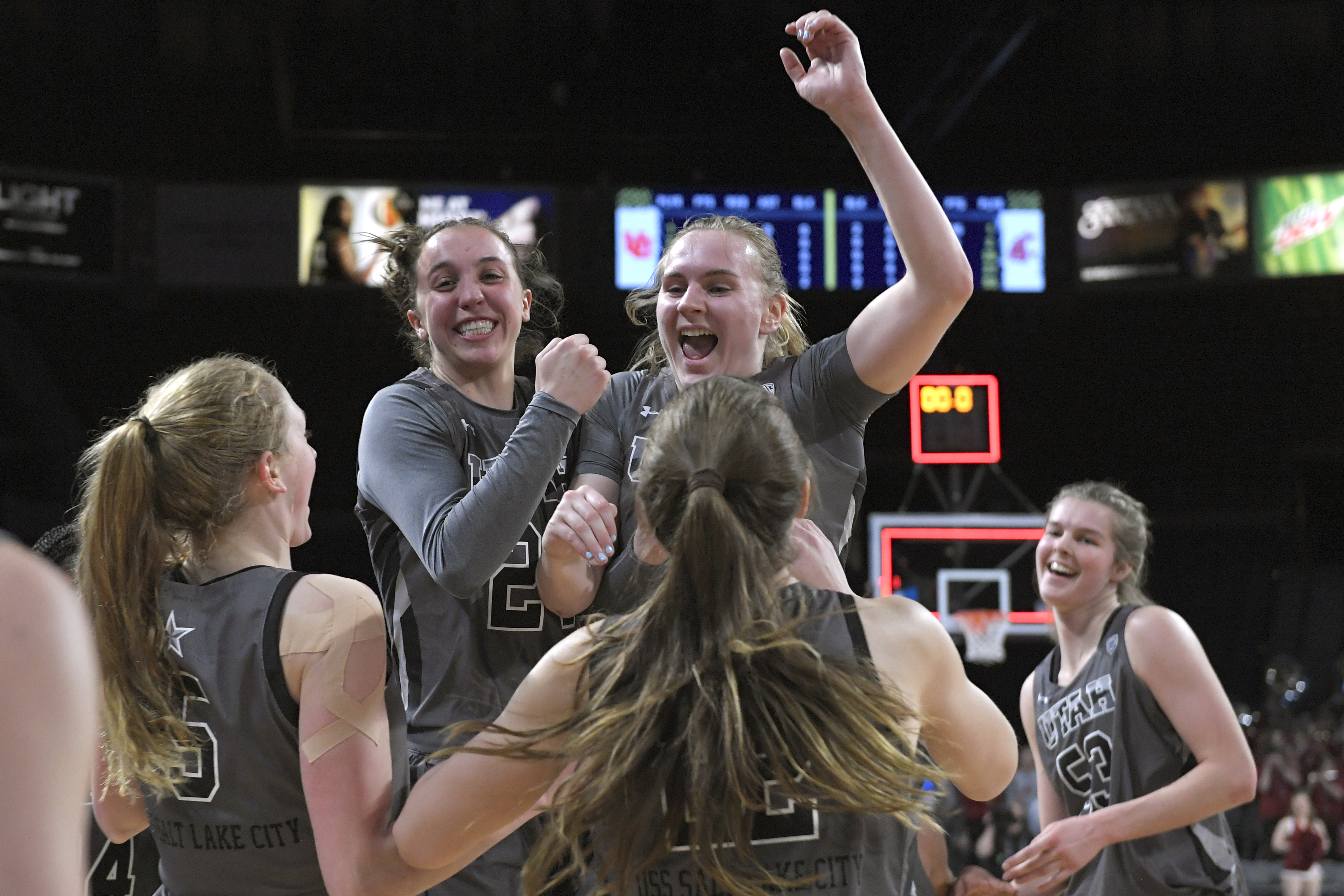 Utah players celebrate a victory over Washington State in an NCAA college basketball game in the quarterfinals of the Pac-12 women's tournament Thursday, March 3, 2022, in Las Vegas.