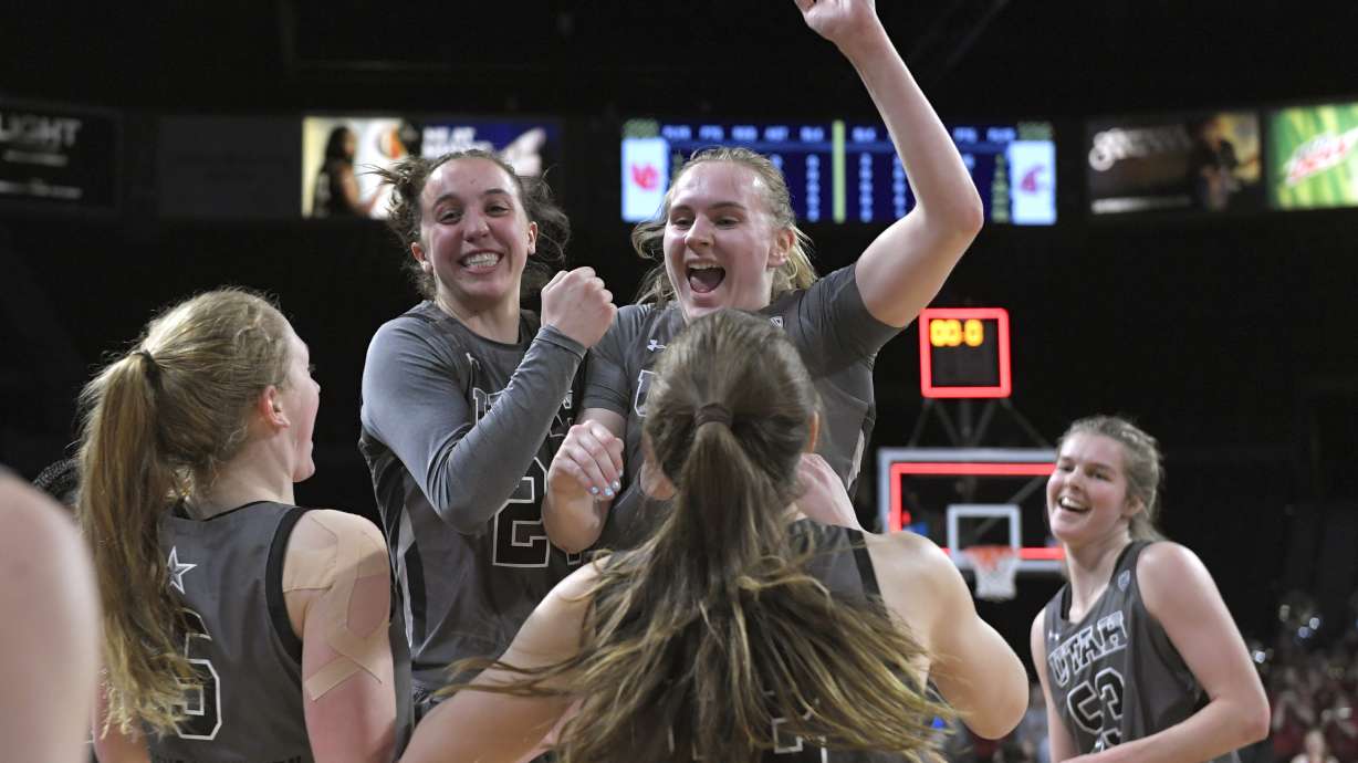 Utah players celebrate a victory over Washington State in an NCAA college basketball game in the quarterfinals of the Pac-12 women's tournament Thursday, March 3, 2022, in Las Vegas.