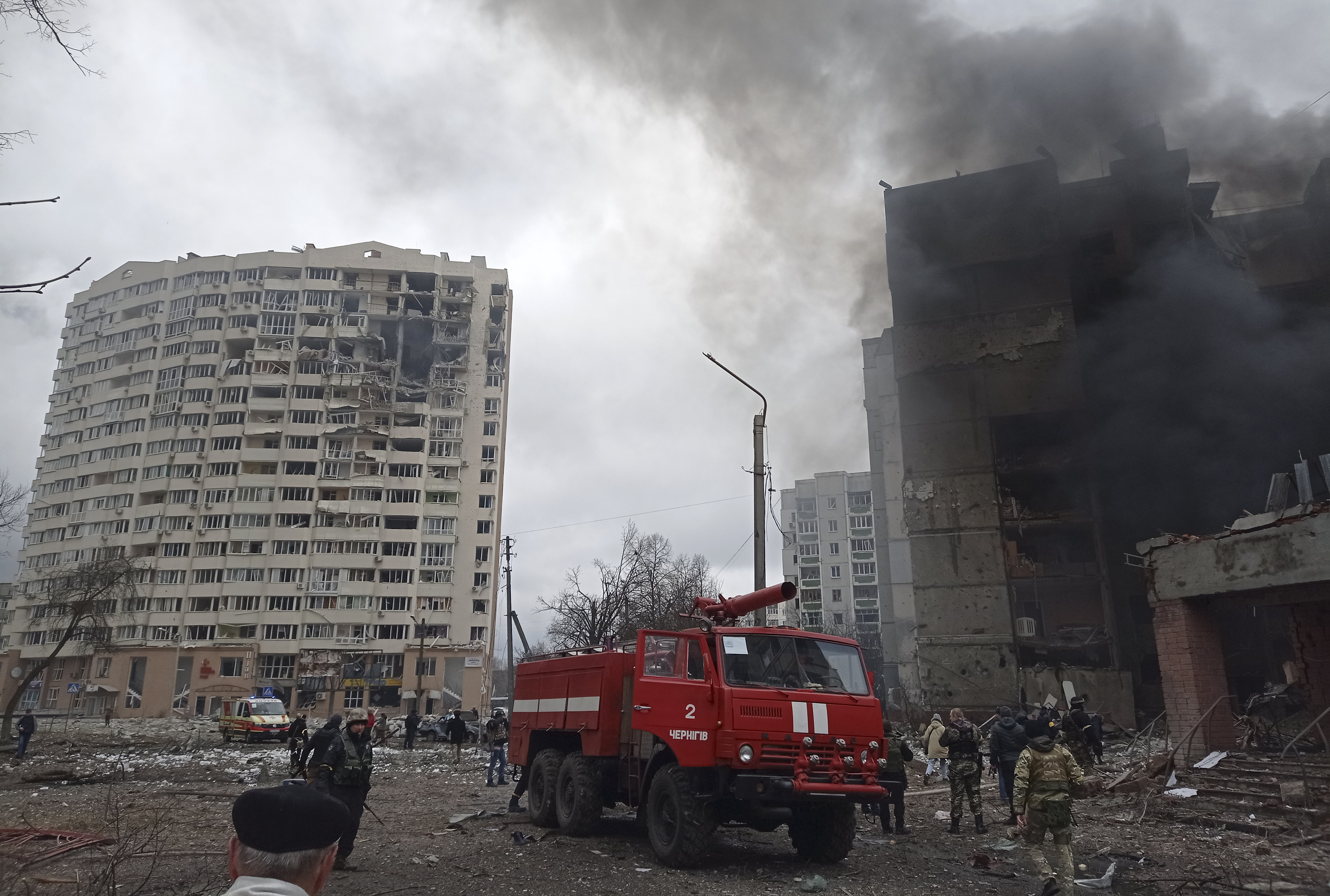 Firefighters work to extinguish a fire at a damaged city center after Russian air raid in Chernigiv, Ukraine, Thursday.