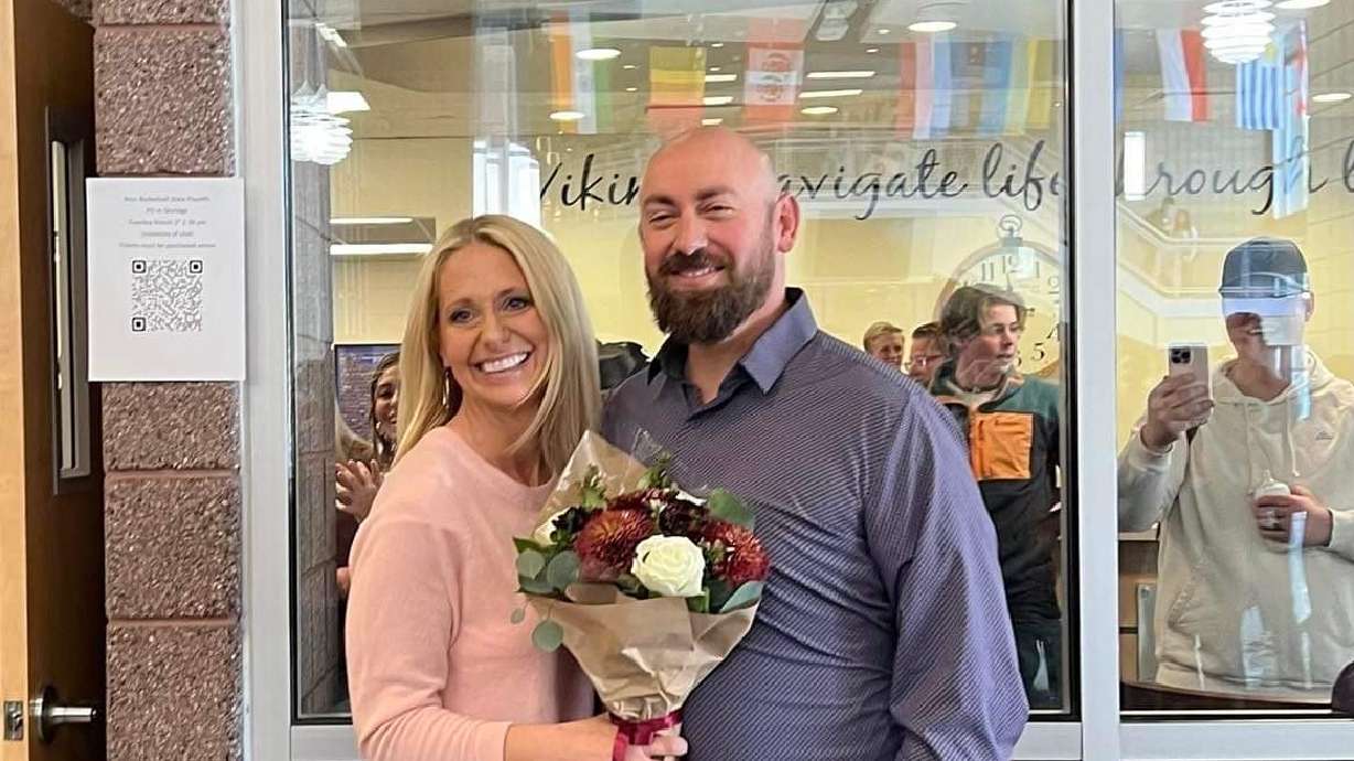 Cassie Farely and Paul Limburg pose for a picture after getting engaged at Pleasant Grove High School last month.