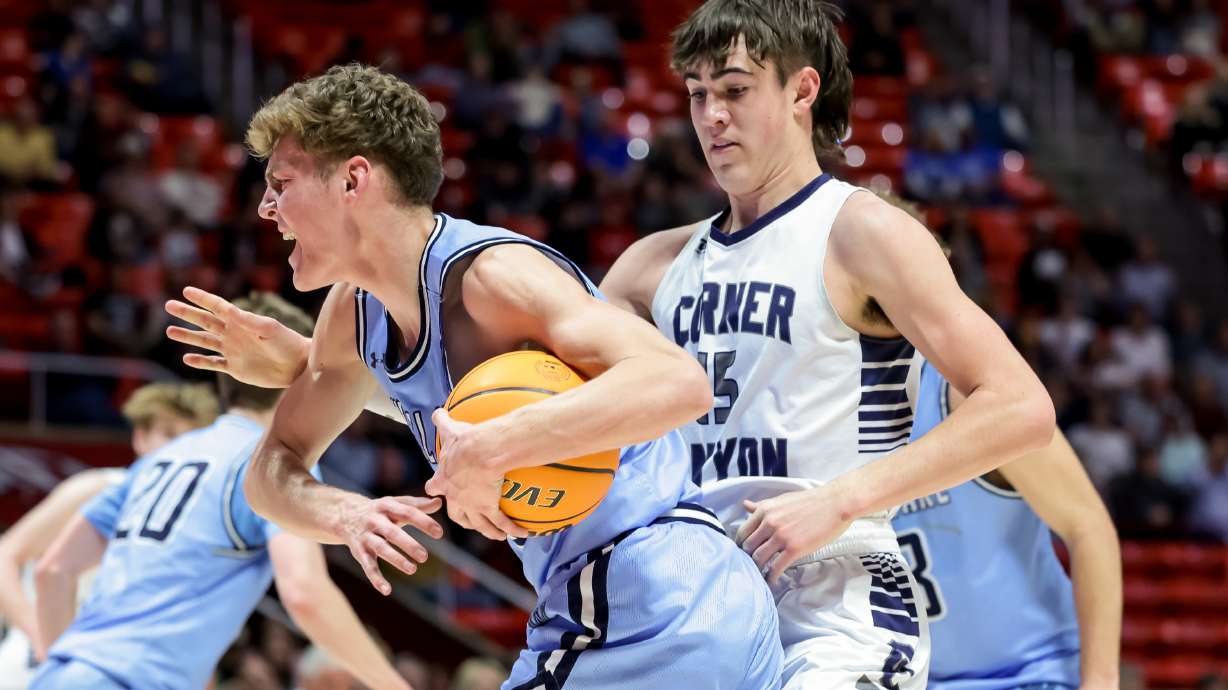Westlake’s Gaige Wendel defends his position against Corner Canyon’s Brody Kozlowski after scooping up a loose ball in a 6A high school boys basketball semifinal game at the Huntsman Center in Salt Lake City on Thursday, March 3, 2022.