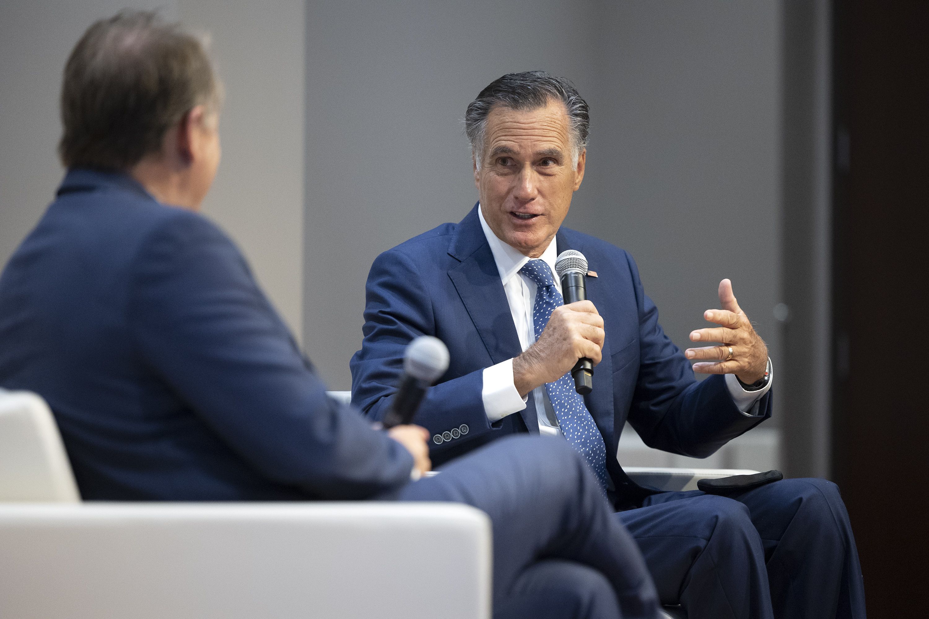 University of Utah President Taylor Randall, left, listens to Utah GOP Sen. Mitt Romney during a discussion at the inaugural Fintech Summit in Salt Lake City on Sept. 17, 2021. Romney, who is not up for reelection, has so far not endorsed Sen. Mike Lee or any of the candidates challenging the two-term incumbent.