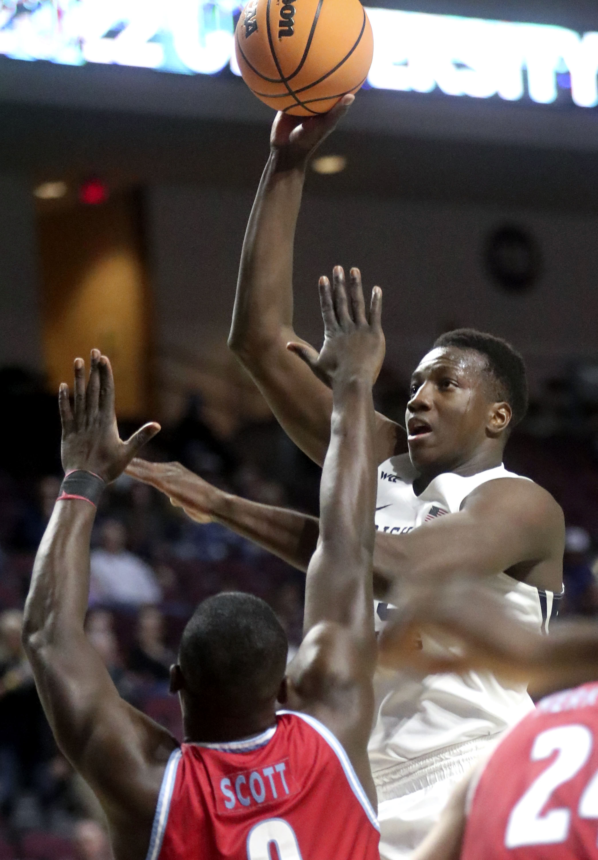Brigham Young forward Fousseyni Traore (45) shoots over Loyola Marymount guard Eli Scott (0) during the second round of the 2022 West Coast Conference men's basketball tournament at the Orleans Arena in Las Vegas on Friday, March 4, 2022. BYU won 85-60.
