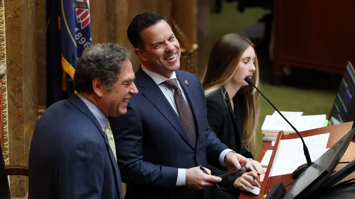 House Speaker Brad Wilson, R-Kaysville, center, laughs as he and House Minority Leader Brian King, D-Salt Lake City, left, talk as they begin the last day of the legislative session at the Capitol in Salt Lake City on Friday.