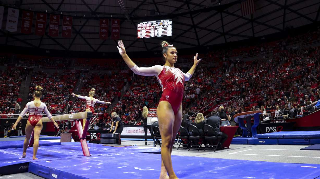 Utah’s Amelie Morgan warms up before competing on the beam as the Utah Red Rocks compete against Minnesota in a gymnastics meet at the Huntsman Center in Salt Lake City on Friday, March 4, 2022.