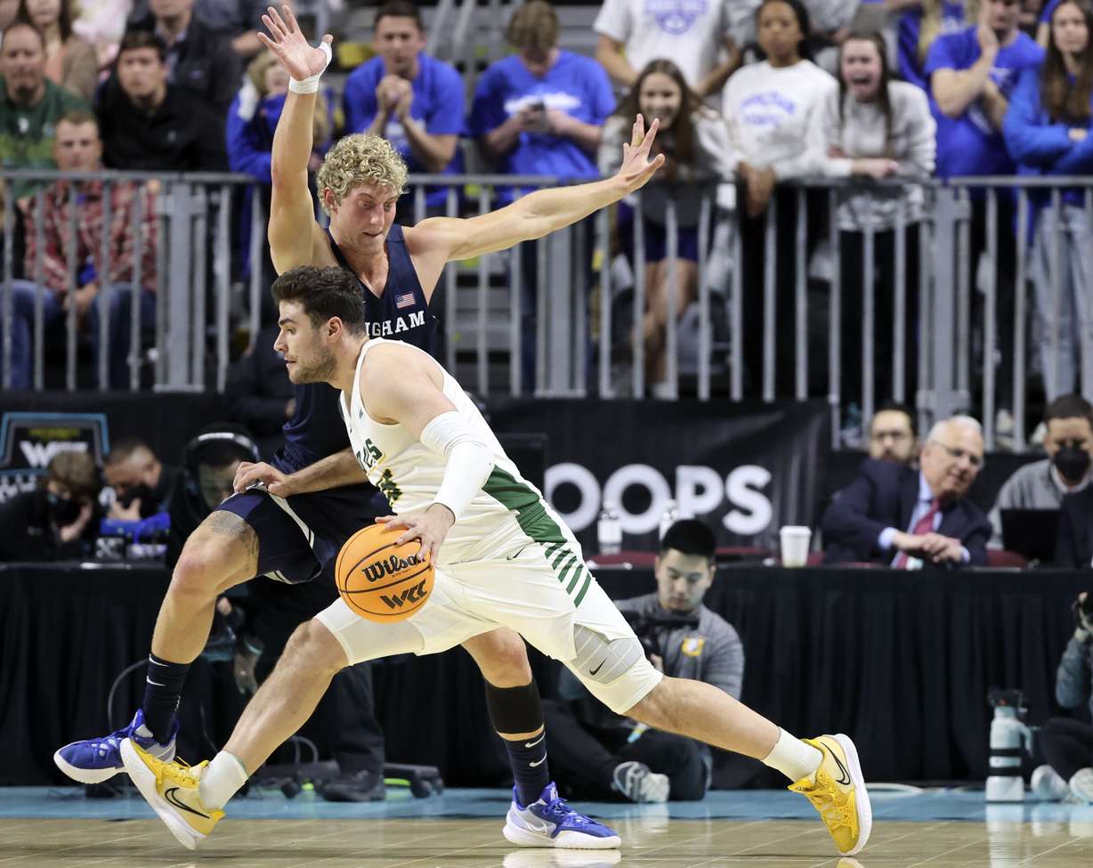 Brigham Young forward Caleb Lohner (33) guards San Francisco guard Gabe Stefanini (15) in the 2022 West Coast Conference men’s basketball quarterfinals at the Orleans Arena in Las Vegas on Saturday, March 5, 2022. BYU lost 63-75, effectively relegating the Cougars to the NIT.