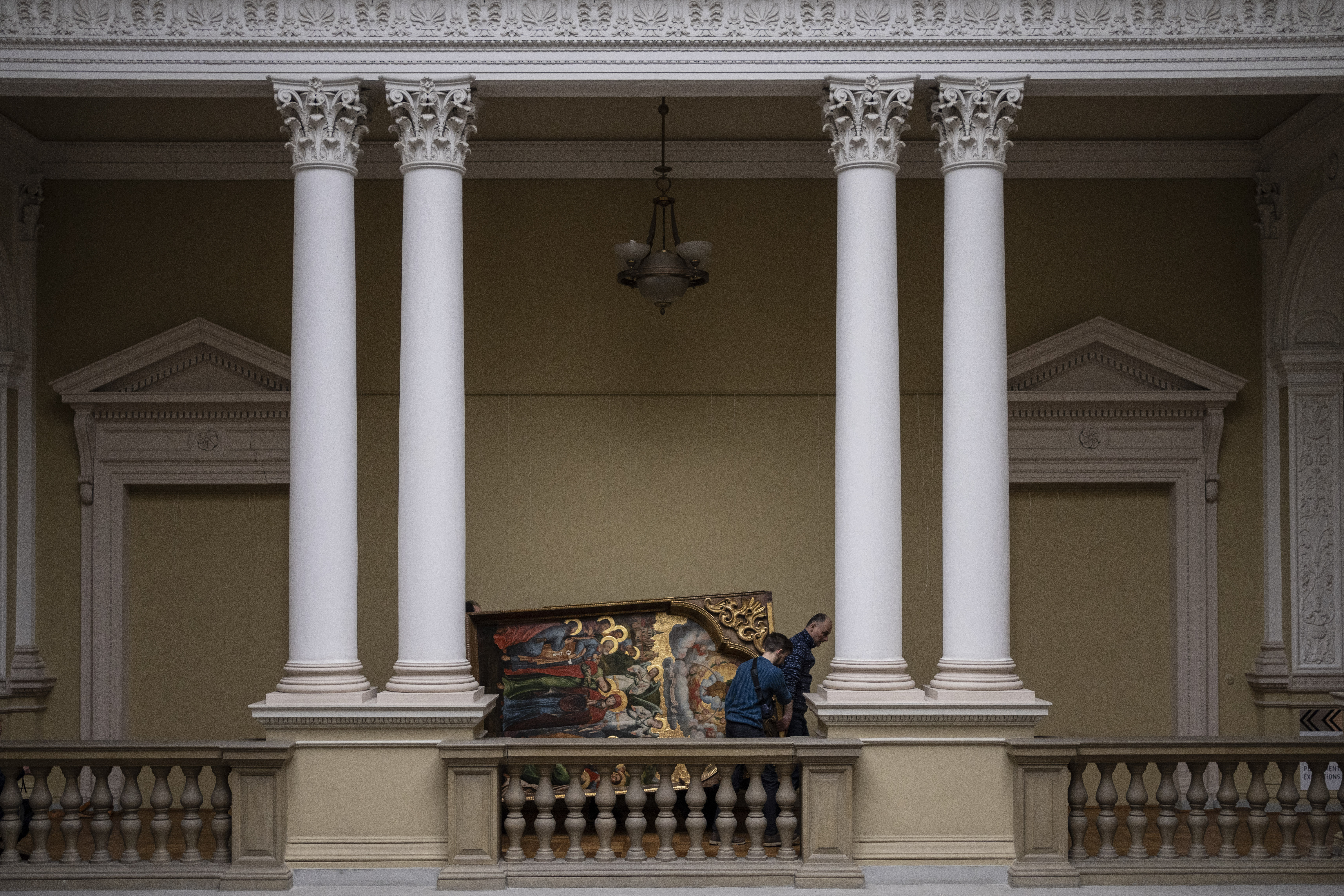 Workers move the Annunciation to the Blessed Virgin of the Bohorodchany Iconostasis in the Andrey Sheptytsky National Museum as part of safety preparations in the event of an attack in the western Ukrainian city of Lviv, Friday, March 4, 2022. The doors of the museum have been closed since Russia’s war on Ukraine began on Feb. 24, and heritage sites across the country face danger as the fighting continues. 