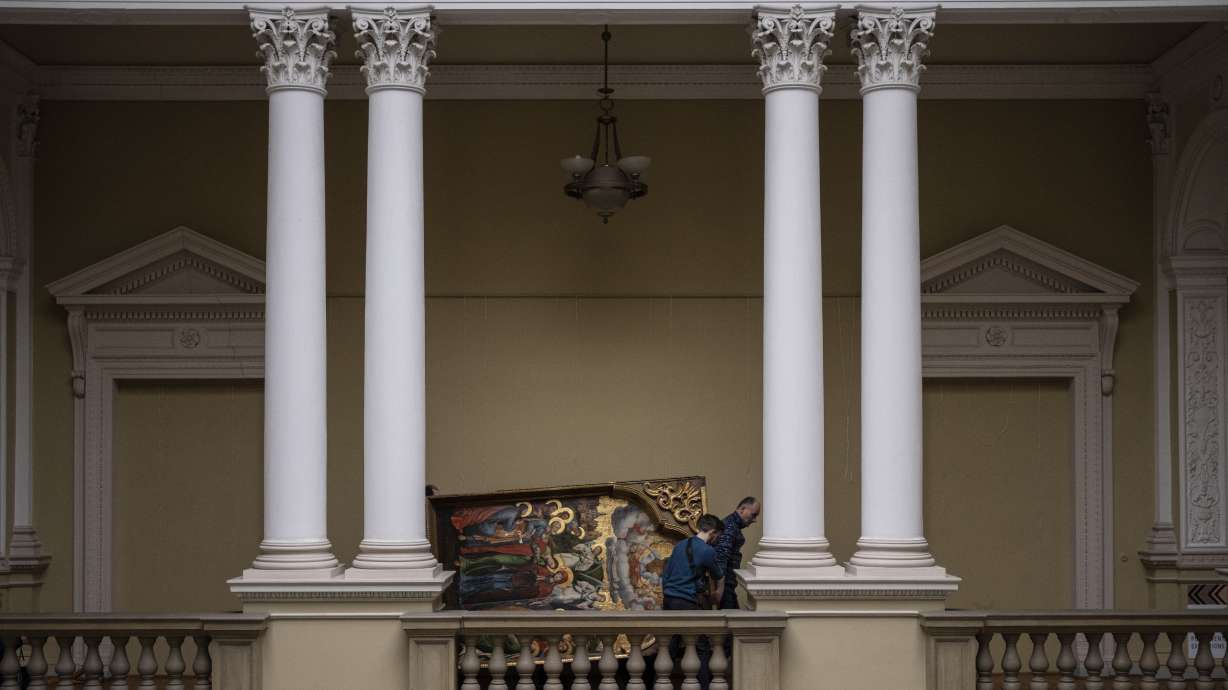 Workers move the Annunciation to the Blessed Virgin of the Bohorodchany Iconostasis in the Andrey Sheptytsky National Museum as part of safety preparations in the event of an attack in the western Ukrainian city of Lviv, Friday, March 4, 2022. The doors of the museum have been closed since Russia’s war on Ukraine began on Feb. 24, and heritage sites across the country face danger as the fighting continues.