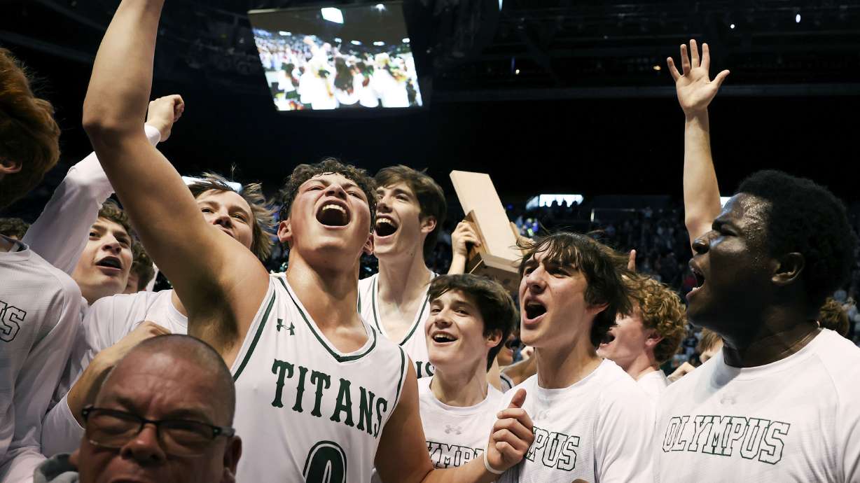 Olympus celebrates their 5A boys basketball state championship win against Woods Cross at BYU in Provo on Saturday, March 5, 2022.